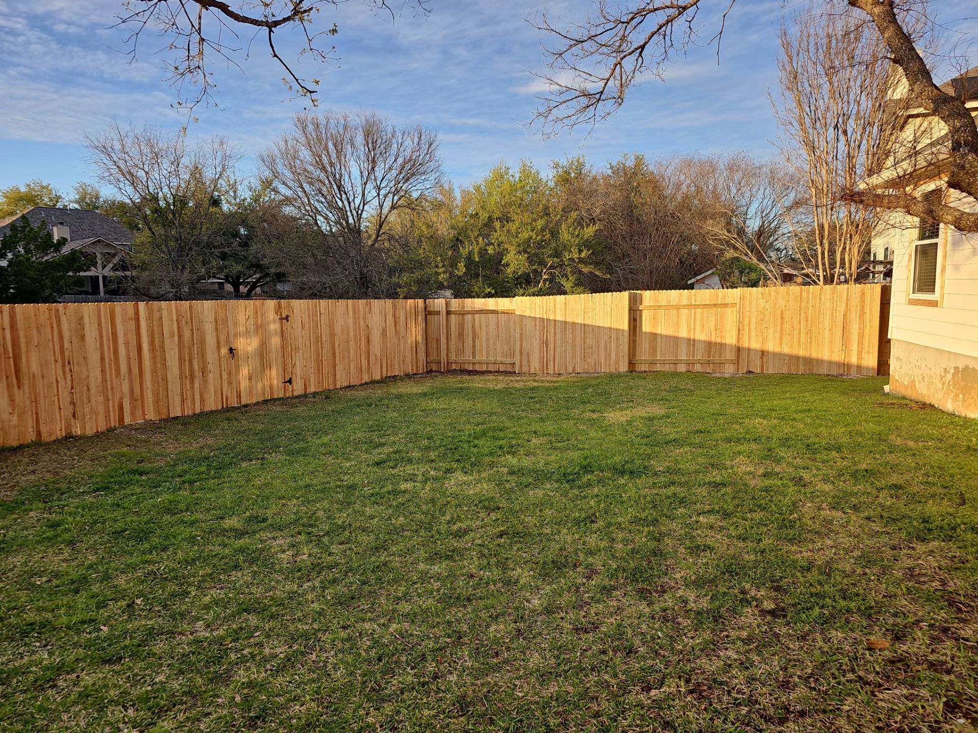 Fence Installation using Cedar Pickets by DeZign Roofing & Exteriors
