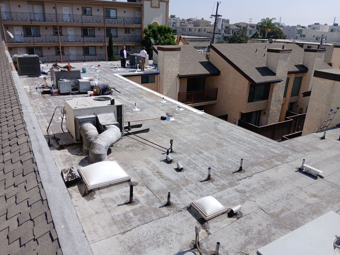 Apartment Building Silicone Coating by Hull Brothers Roofing