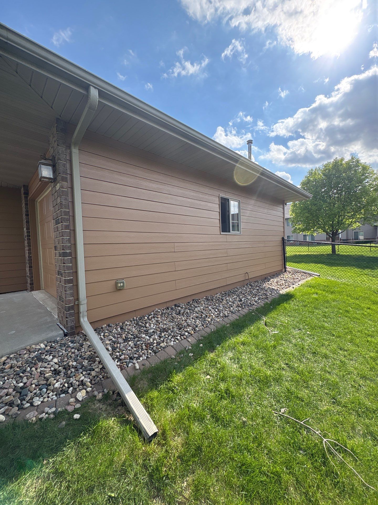 Sioux Falls Residential Exterior Door and Siding Refresh by Select Painting, Coatings & Garage Cabinets