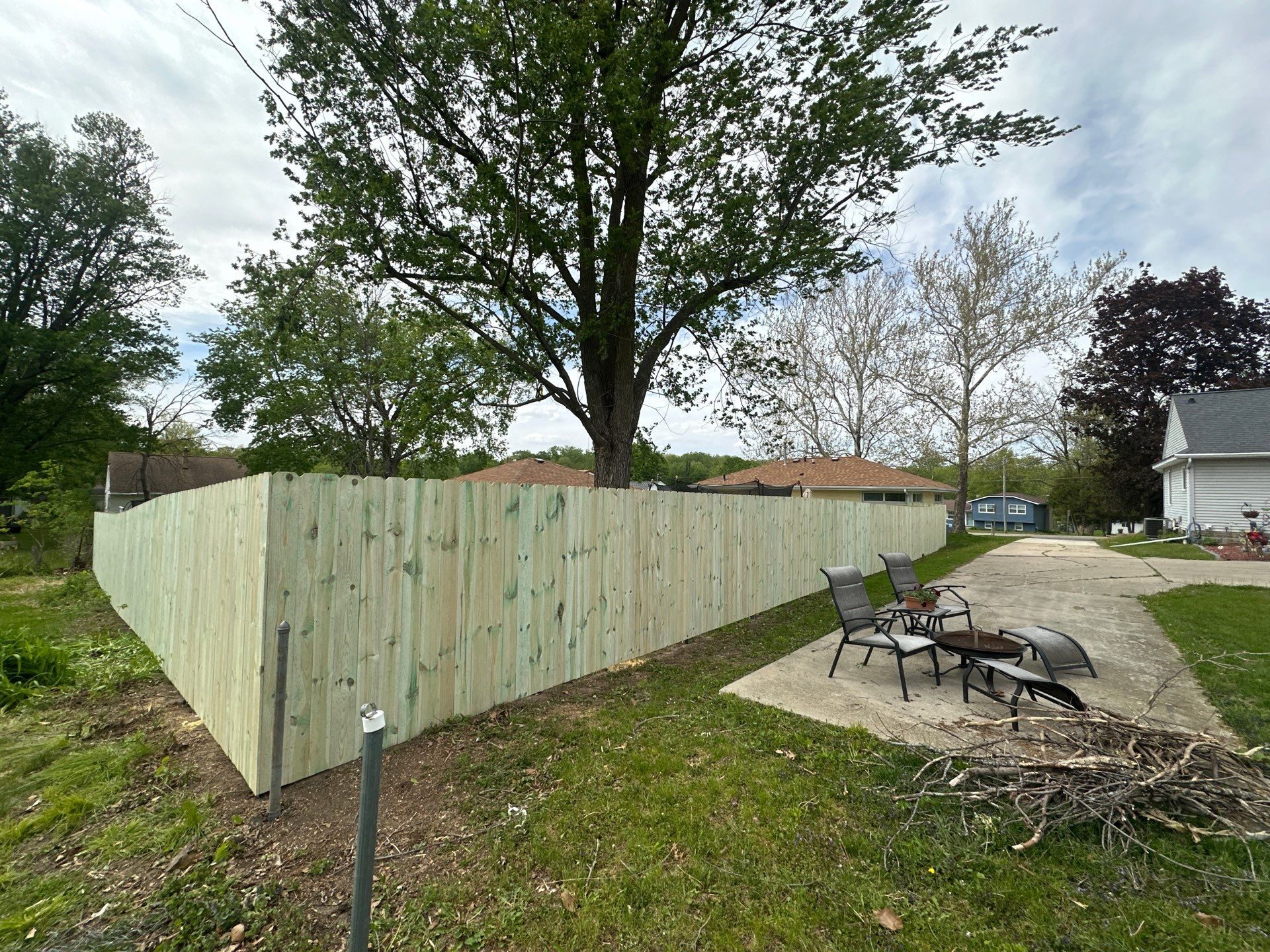 Pressure-Treated Wood Privacy Fence Installation in Waterloo by Perfect Picket Fence and Stain