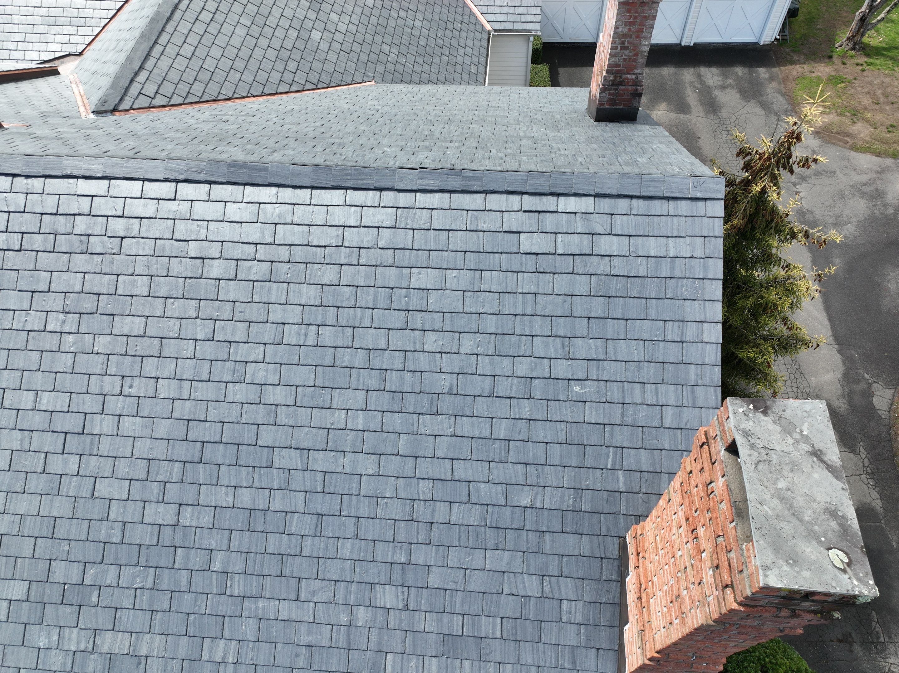 Residential Roofing Installation using Vermont Slate by A Plus Exterior