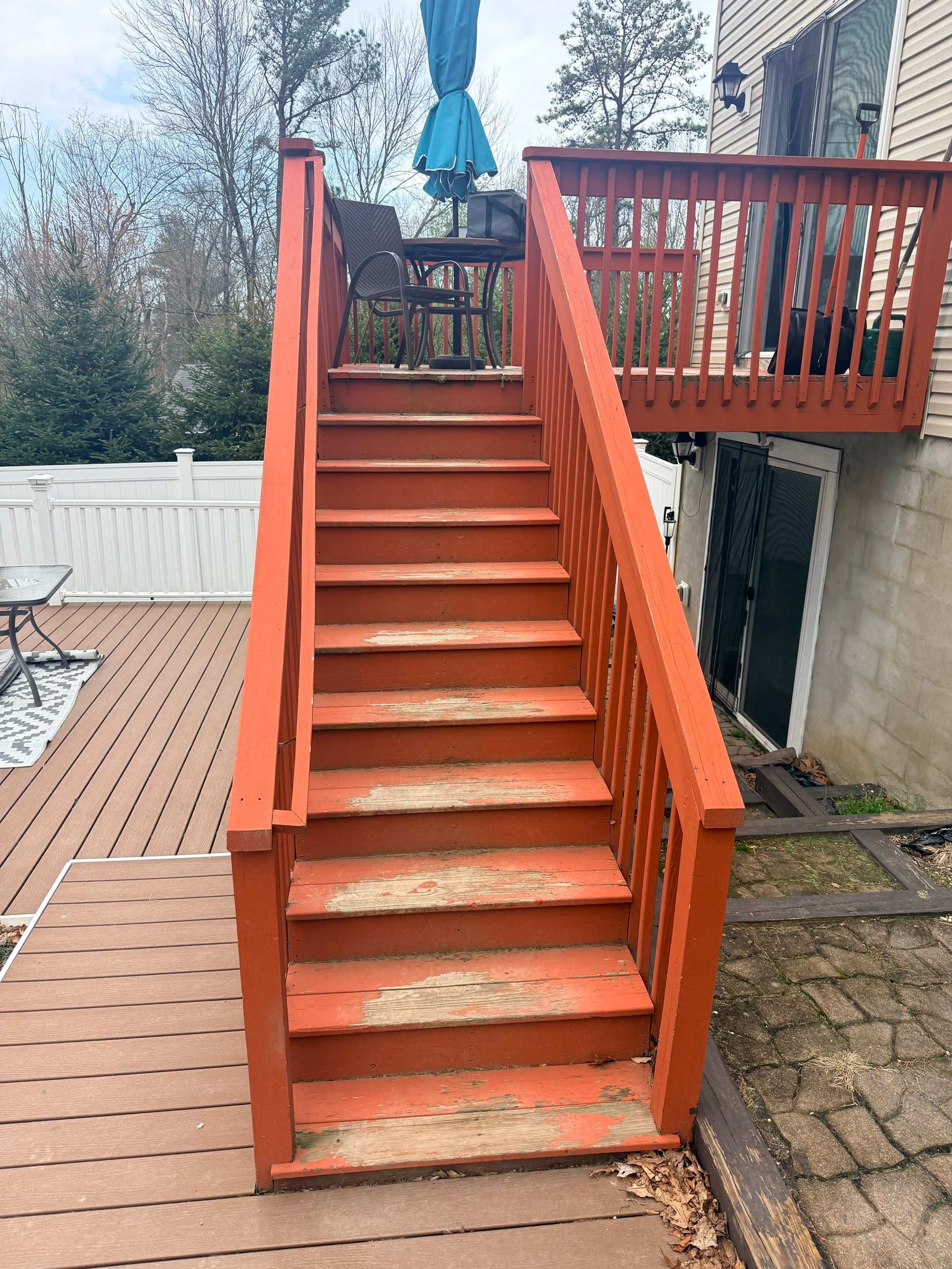 Elevated Composite Deck Replacement with White Railing in Tannersville by Herts Roofing & Construction