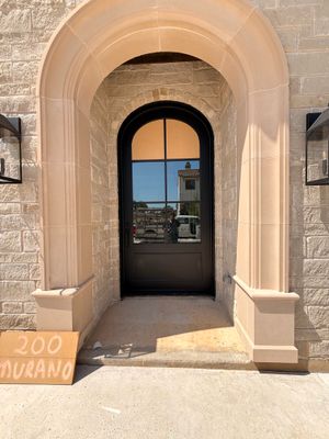 Custom Black Metal Arched Entry Door Installation in Southlake