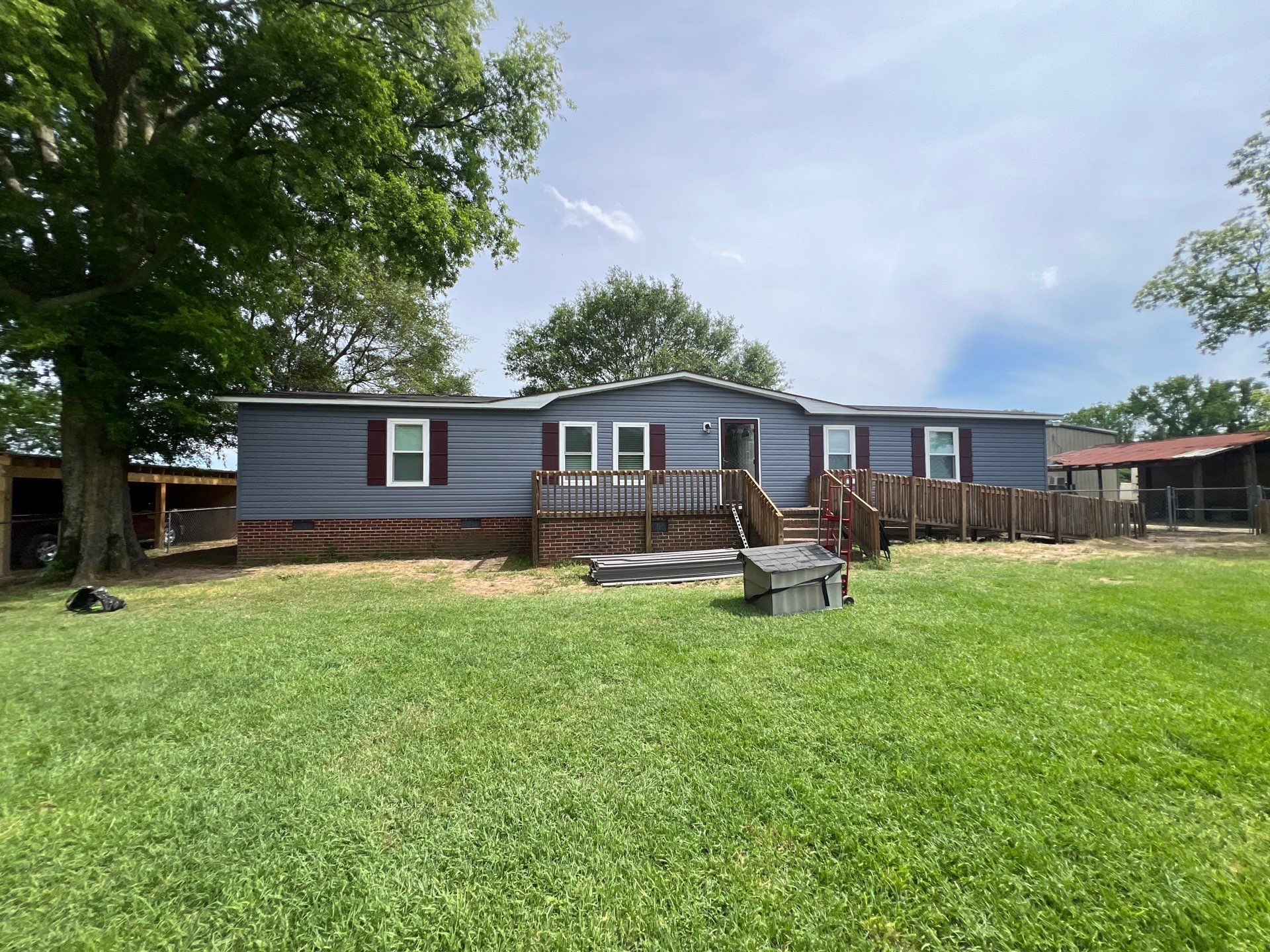 Vinyl Siding and Window Replacement for Goldsboro Modular Home by The Remodeling Company