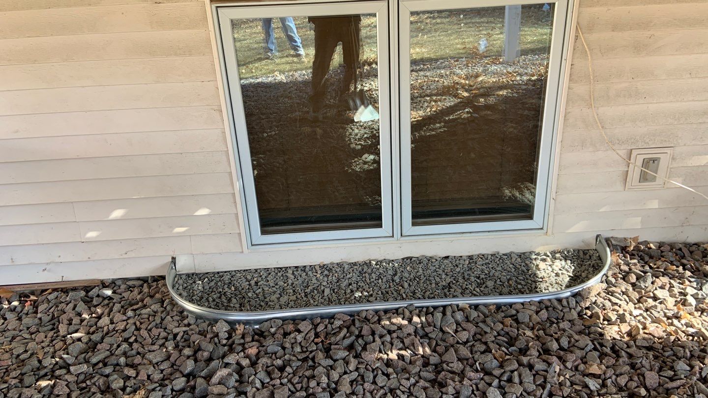 Basement Window Well & Drainage Board in Maple Grove, MN by Waterproofing Northeast