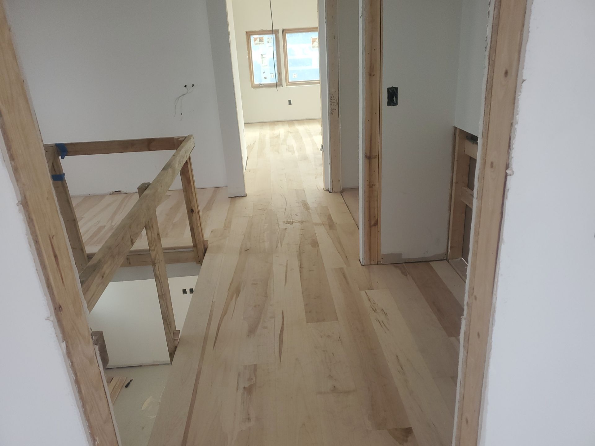 Full glue down Installation over radiant heat 7" Maple character grade by Ann Arbor Hardwoods 