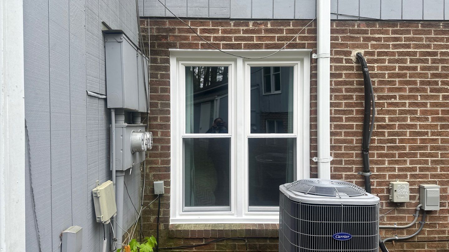White Vinyl Double-Hung Window Replacement in Fuquay-Varina by The Remodeling Company