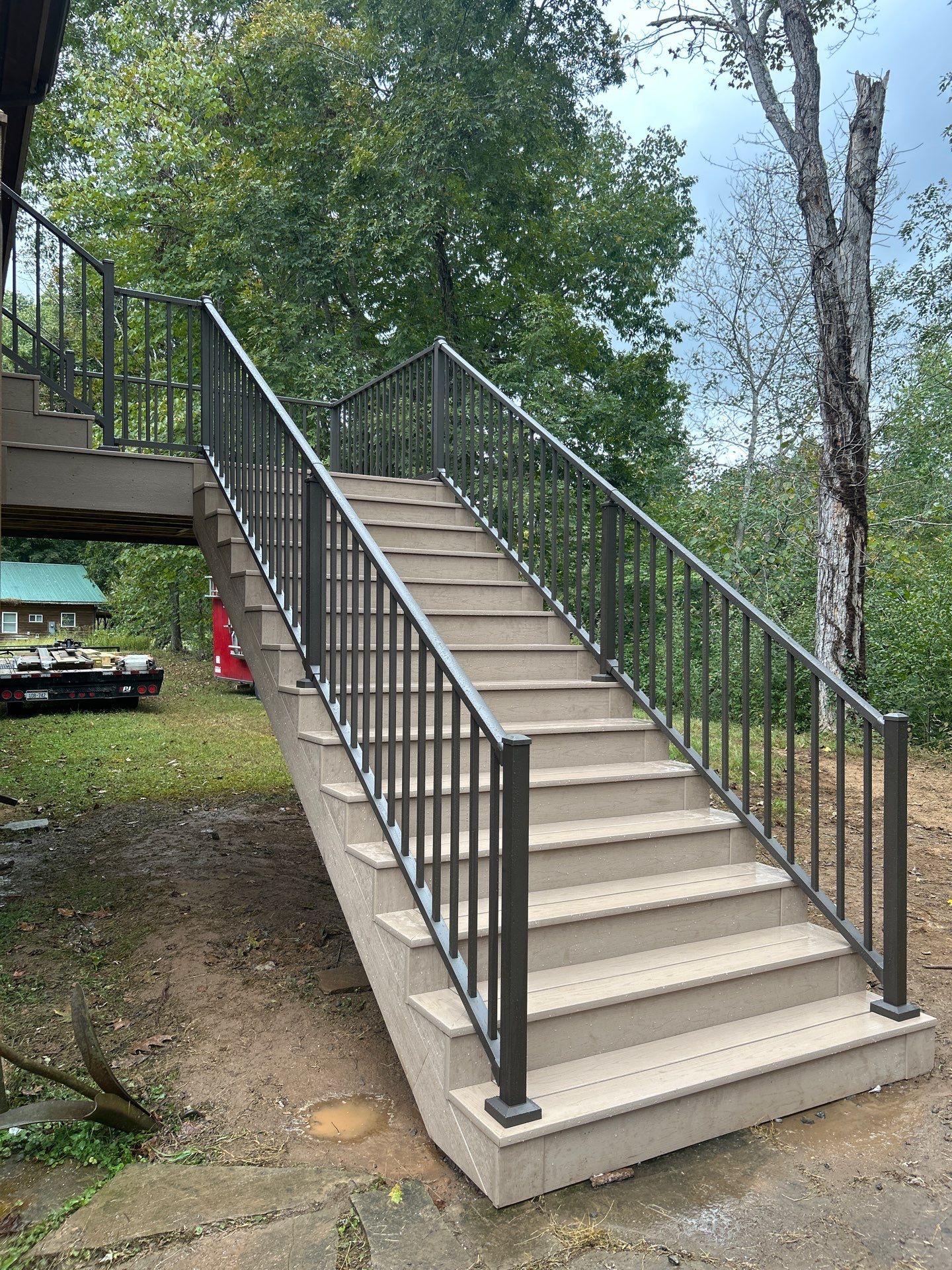 Log Cabin Wrap-Around Deck and External Staircase Installation in Caldwell by Walnut Hollow Decks & Outdoor Living