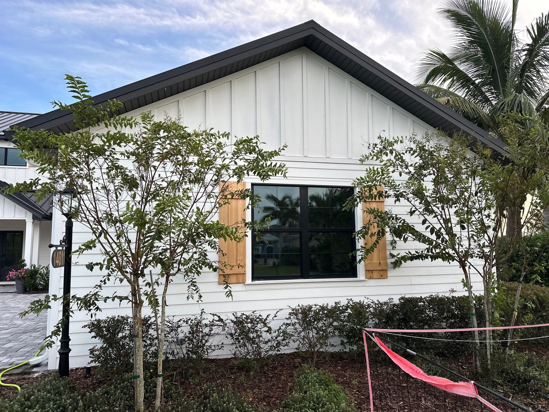 Complete Two-Story House Wash and Driveway Cleaning in Winding River Community, Bradenton, FL by Sunshine AquaWash