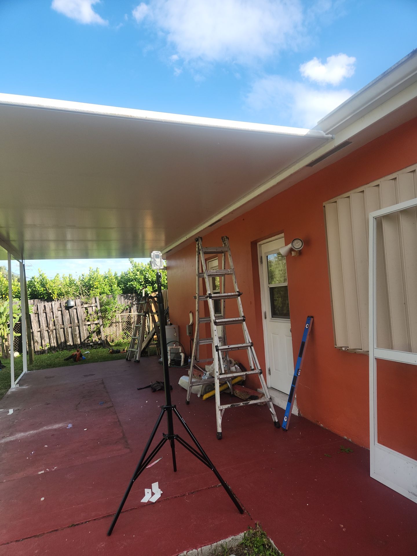 Insulated Screen Enclosure and Wood Tile Deck Installation in Plantation by Aastro Roofing