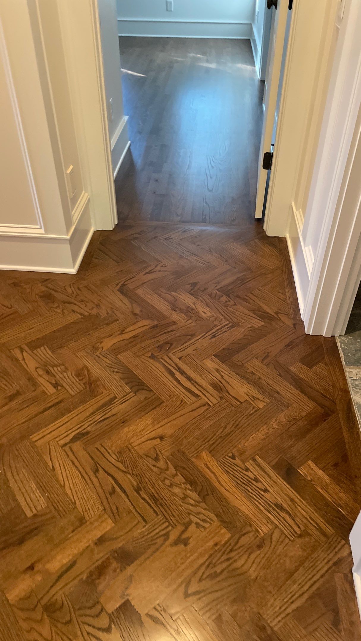 Herringbone Wood Hallway and Rooms by Footprints Floors of Coastal Carolina