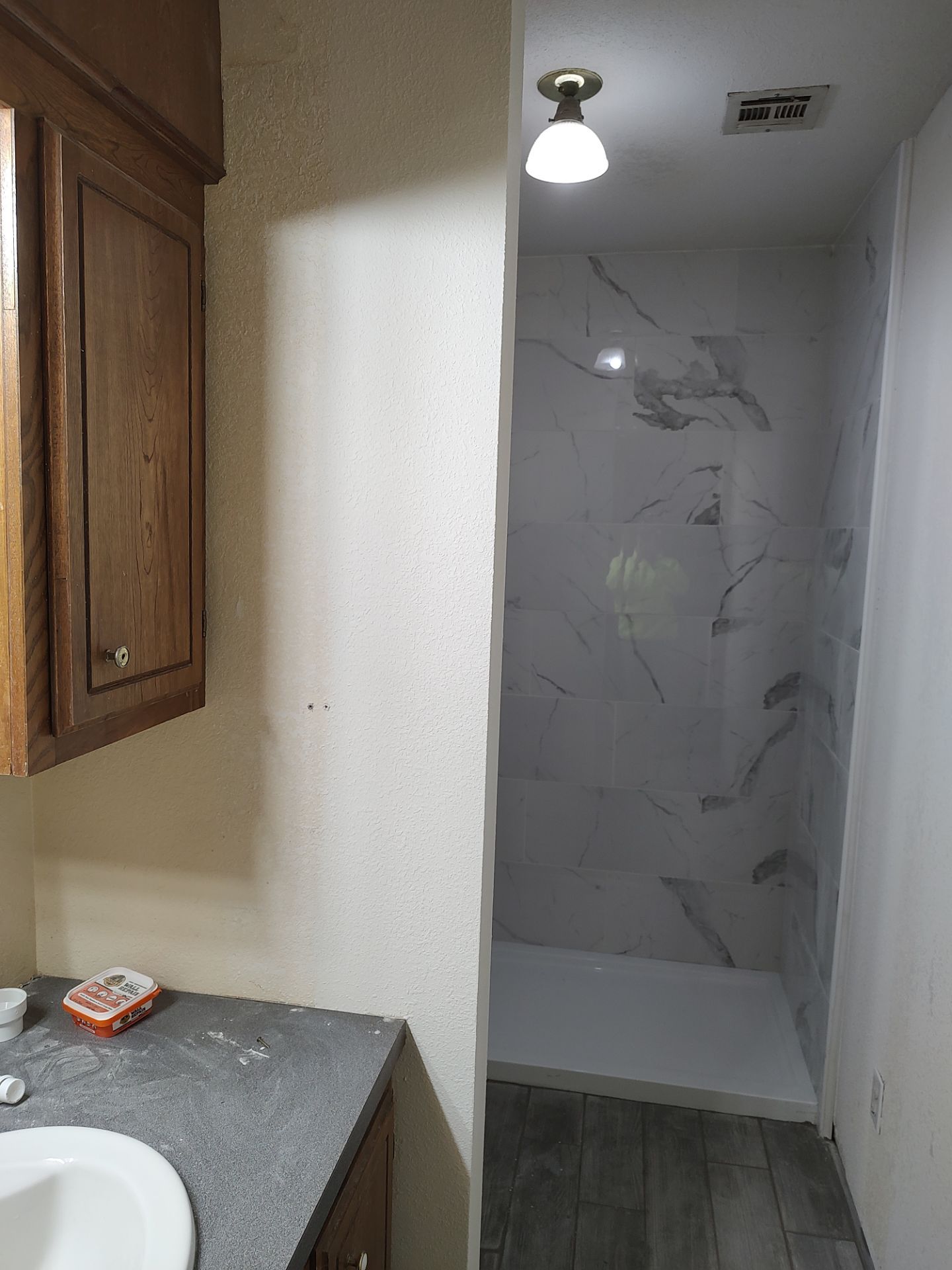 Bathroom remodel w/shower upgrade by In & Out Construction & Remodeling, LLC