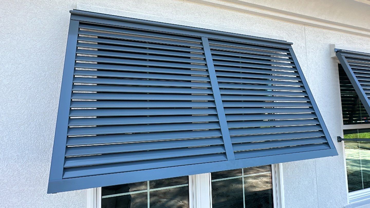 Bahama Shutters in Blue Grey  by Smart Guard Shutters