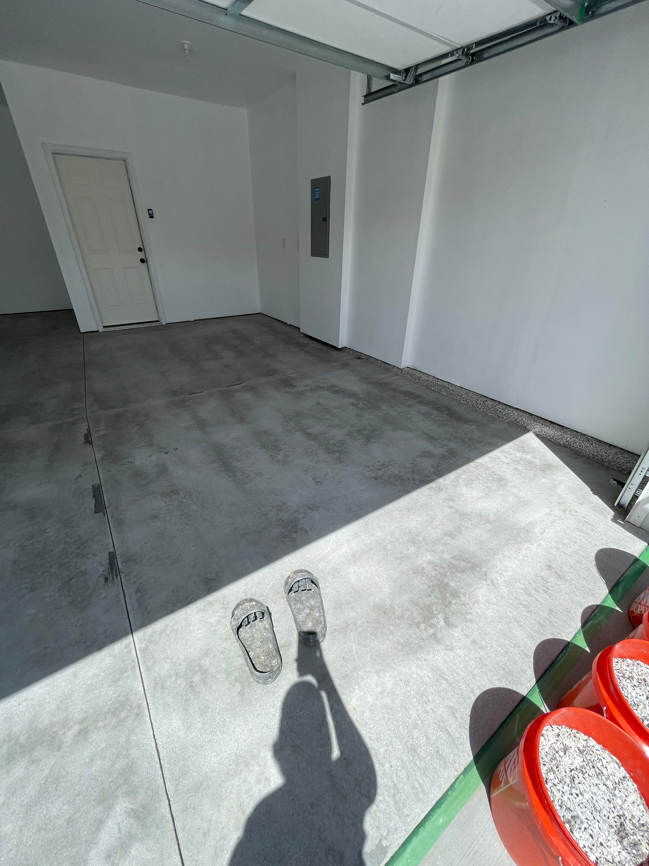 Sioux Falls Garage Floor Transformation with Cabin Fever Decorative Chips by Select Painting, Coatings & Garage Cabinets