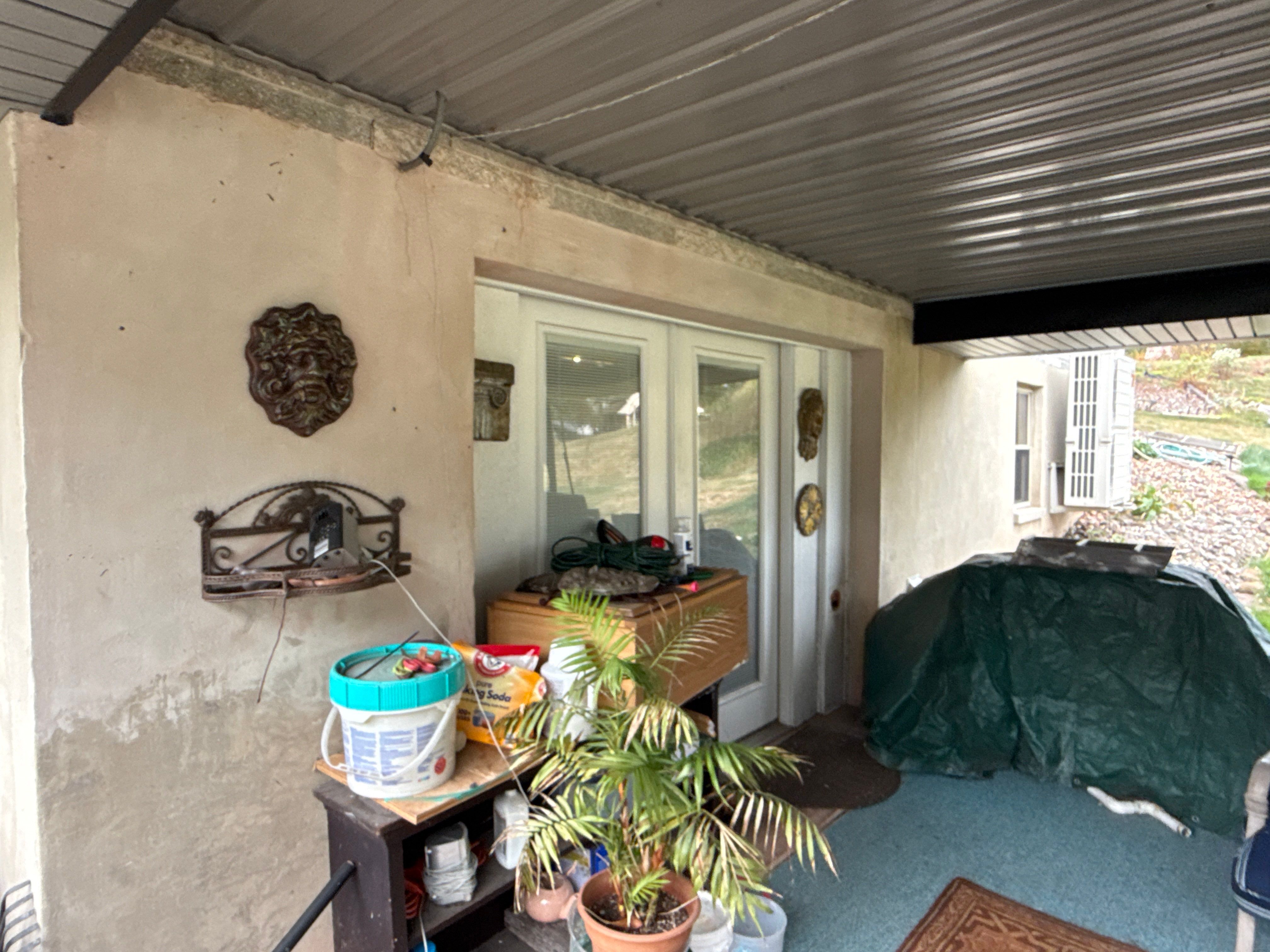 Metal Roofing, Board & Batten Siding, and Entry Door Transformation by Esh Builders