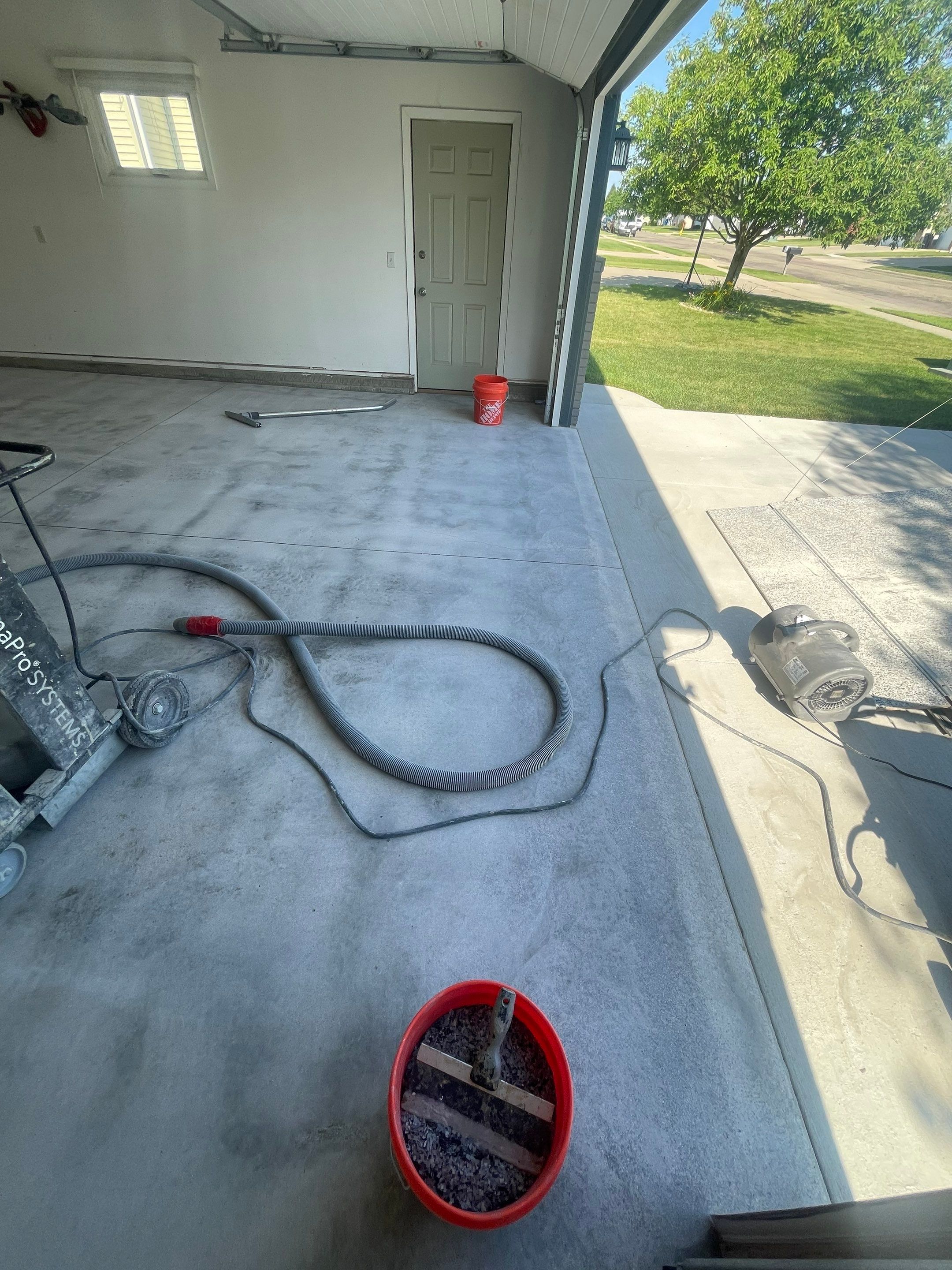 Sioux Falls Garage Floor Coating with Nightfall Decorative Chips by Select Painting, Coatings & Garage Cabinets