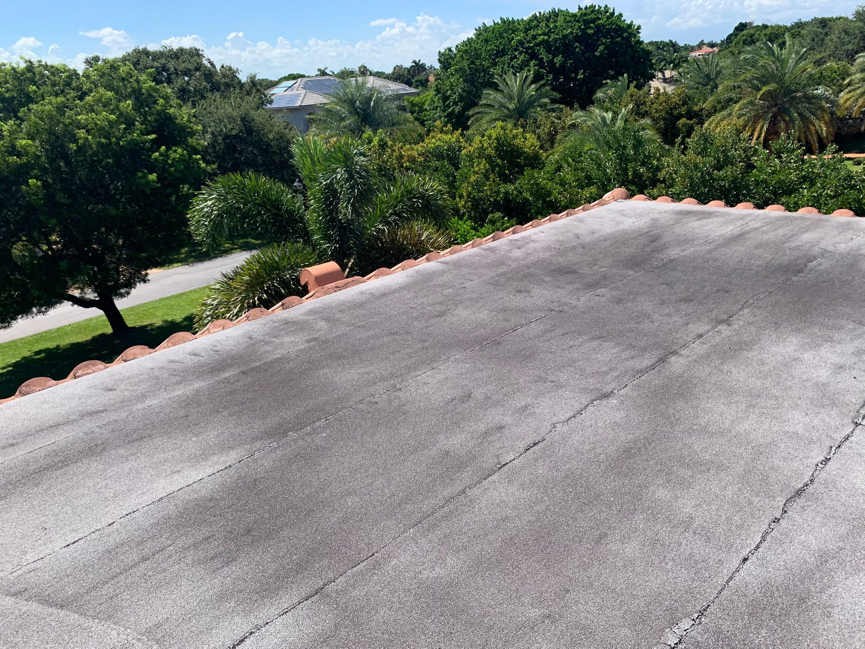 Residential Roofing Installation using Polybrite 90.1 silicone coating by BLUES BROTHERS CONSTRUCTION CORP