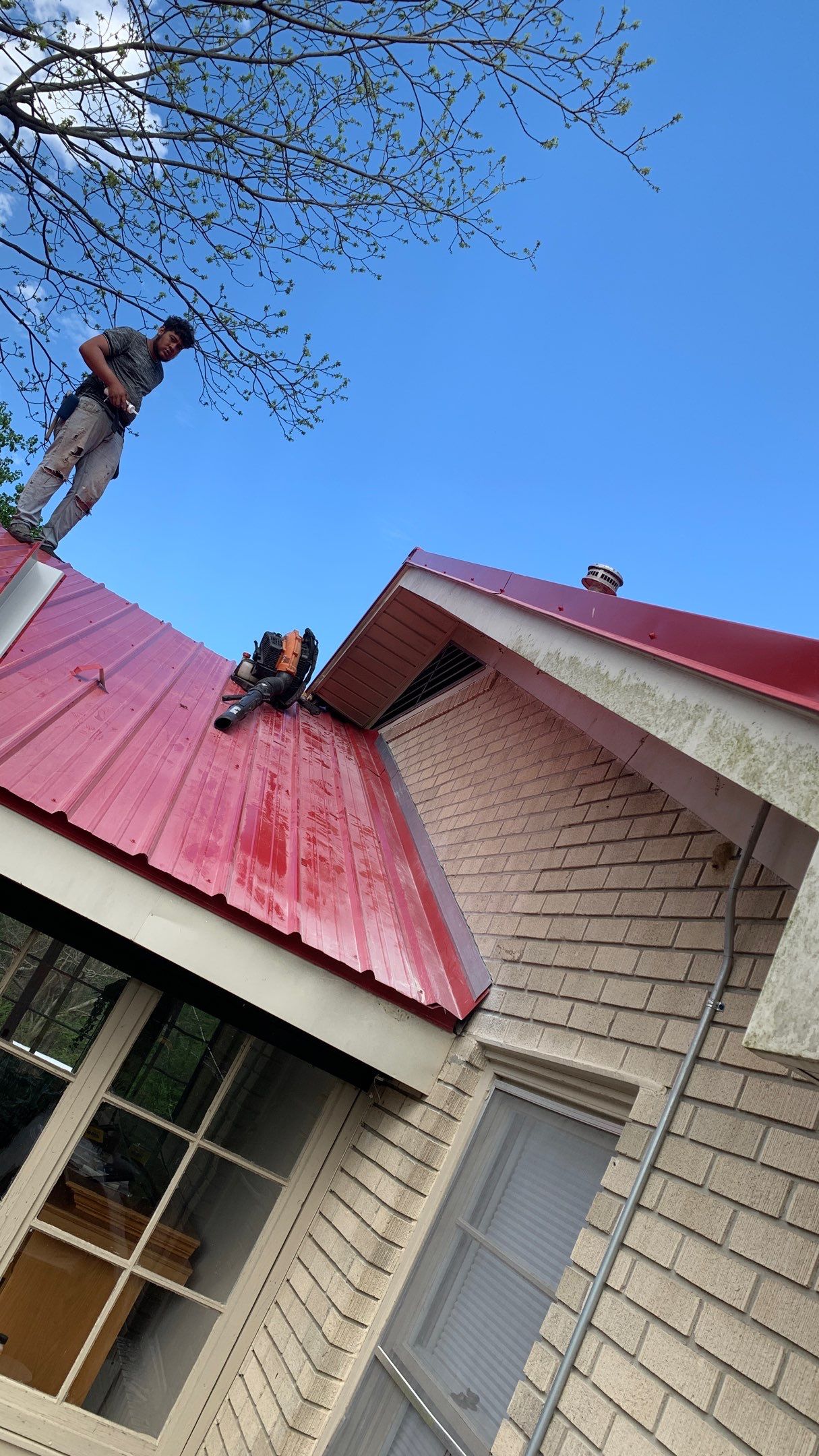 Residential Roofing Installation using 26 Gauge Colored Panels by Hostetler Roofing