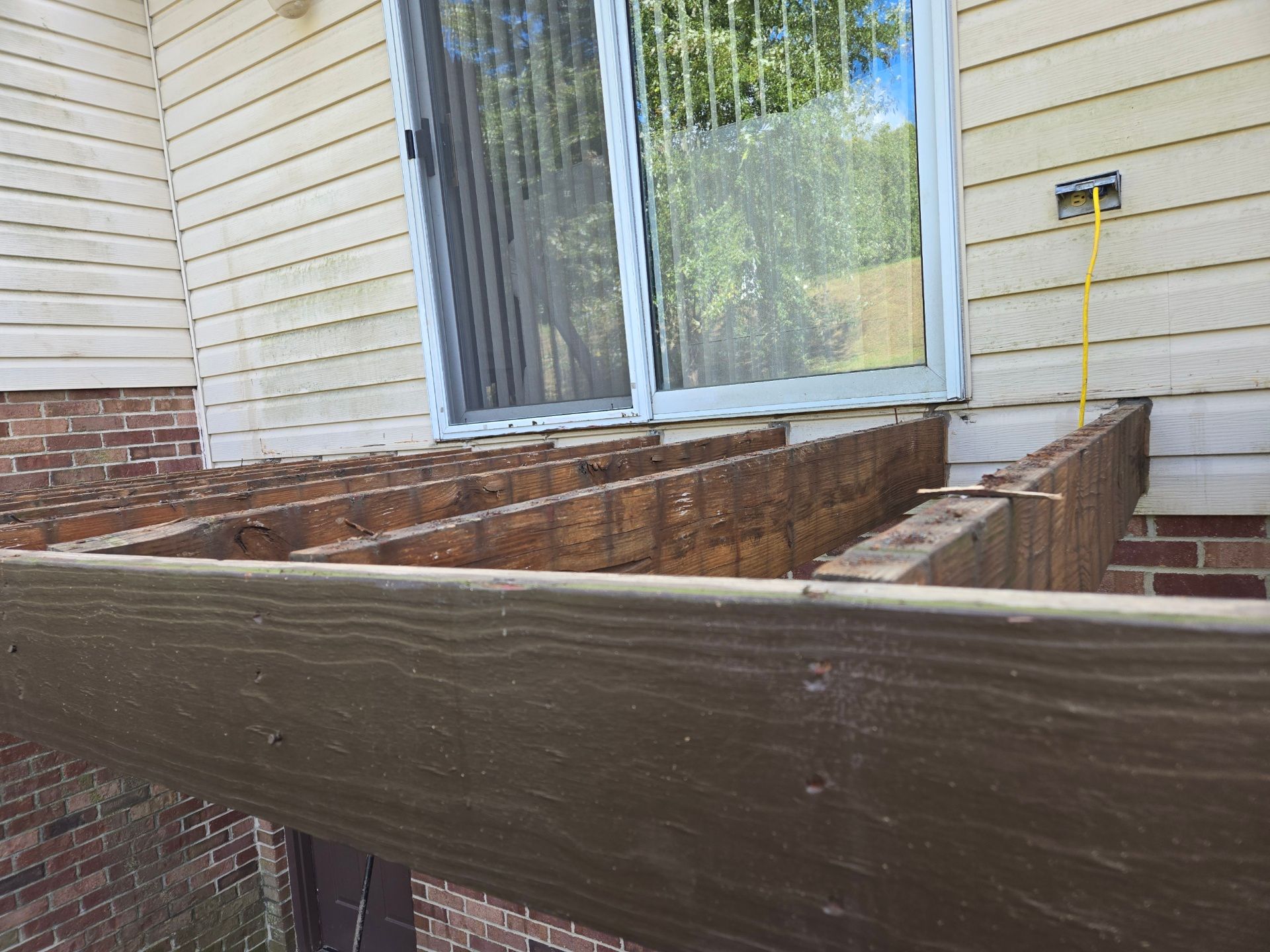 Stamped concrete and redeck  by Cousins Roofing Siding & Decks