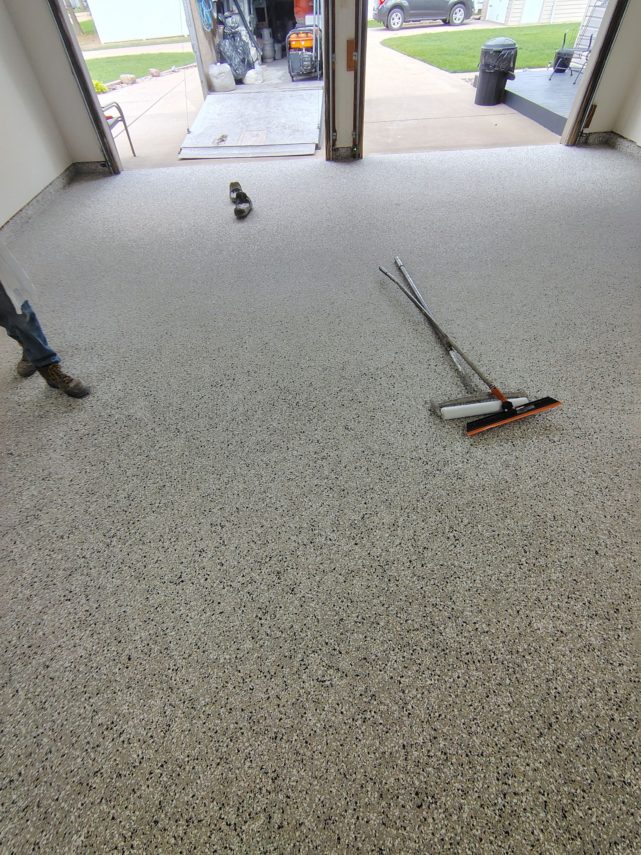 Full-Flake Epoxy Garage Floor Coating Installation in Sioux Falls by Select Painting, Coatings & Garage Cabinets