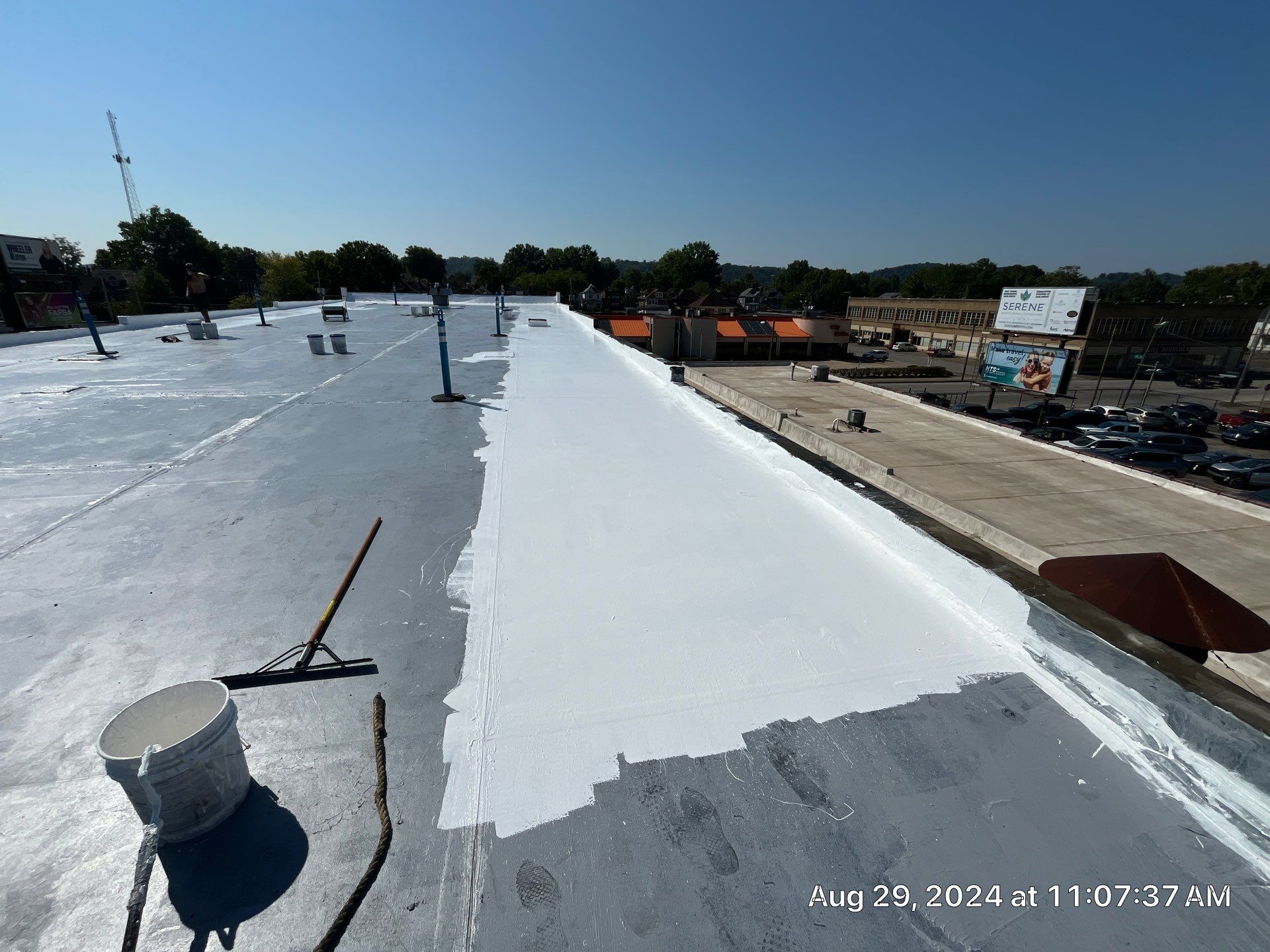 Commercial Roofing Installation using smartcoat Roof coating by Fahey Roofing + Contracting