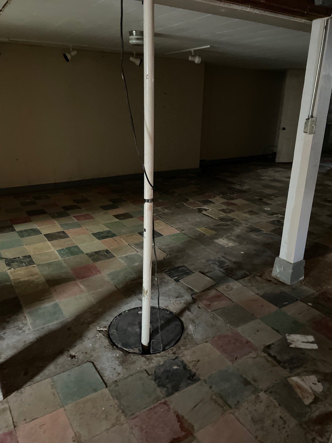 Interior drain tile system installation by ACE Waterproofing & Basement Solutions