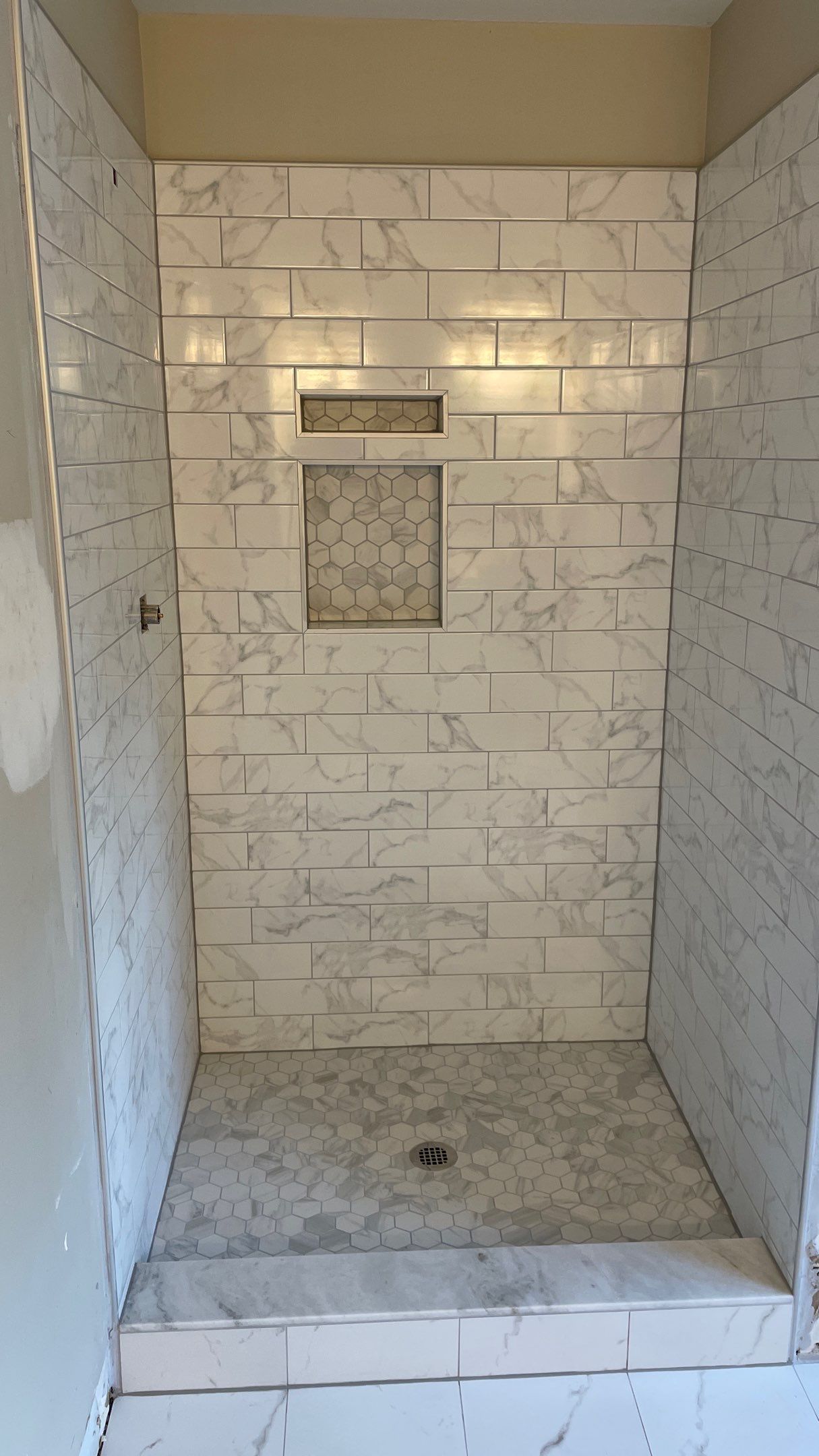 Bathroom Remodel with new Subway Tile Shower by Footprints Floors of Coastal Carolina