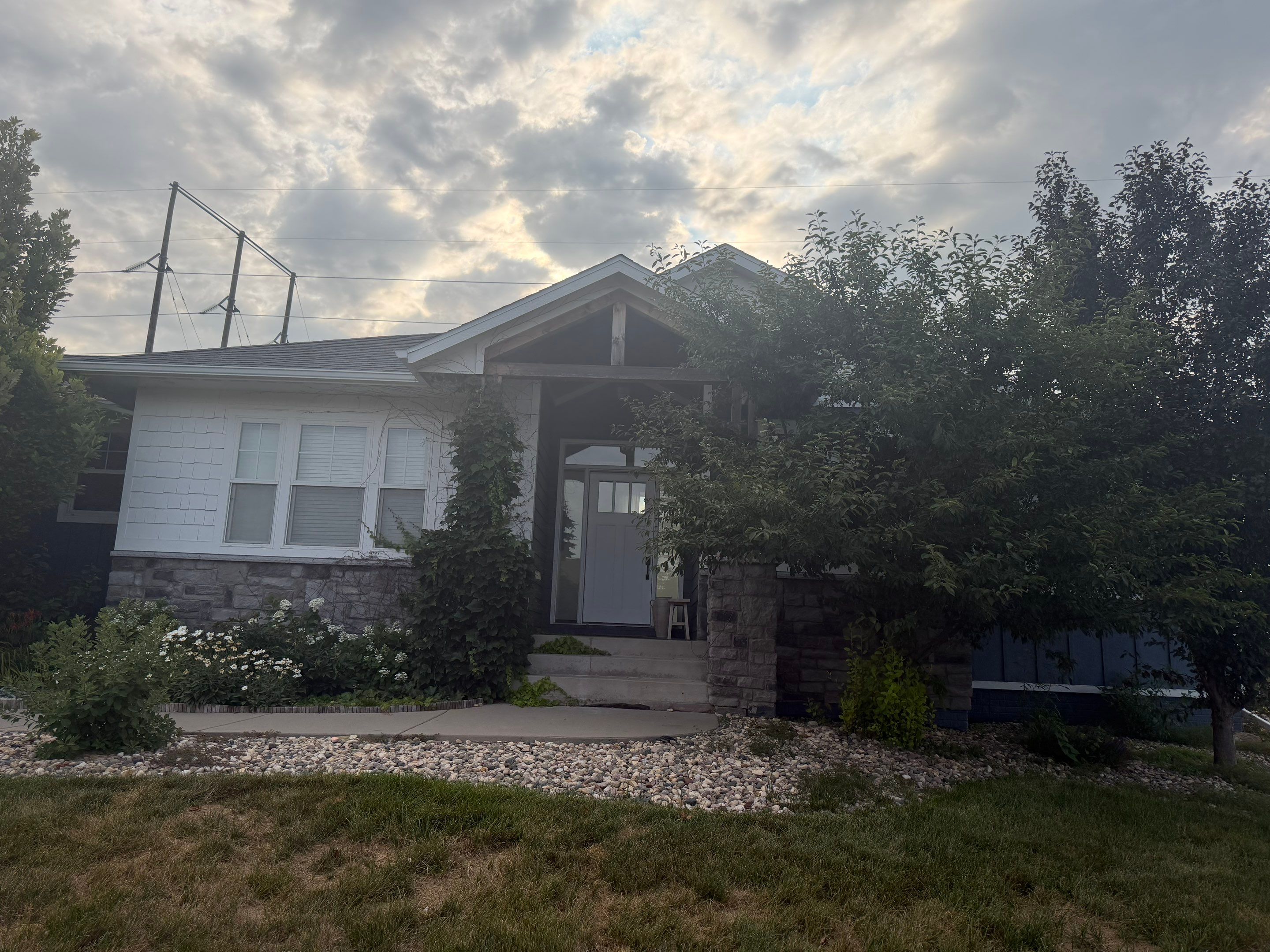 Sioux Falls Exterior Residential Siding and Deck Painting Project by Select Painting, Coatings & Garage Cabinets
