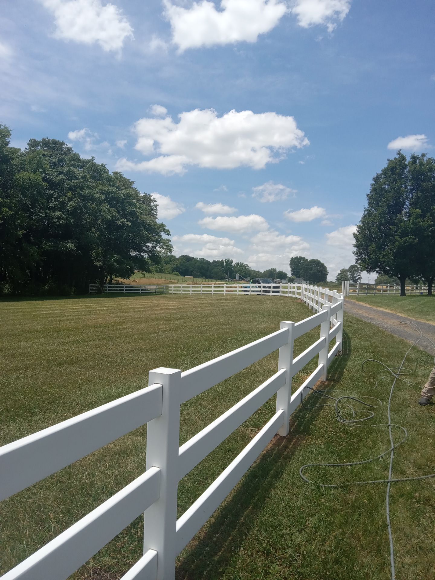 pressure washing white fence removing dirt and stains bringing back original color