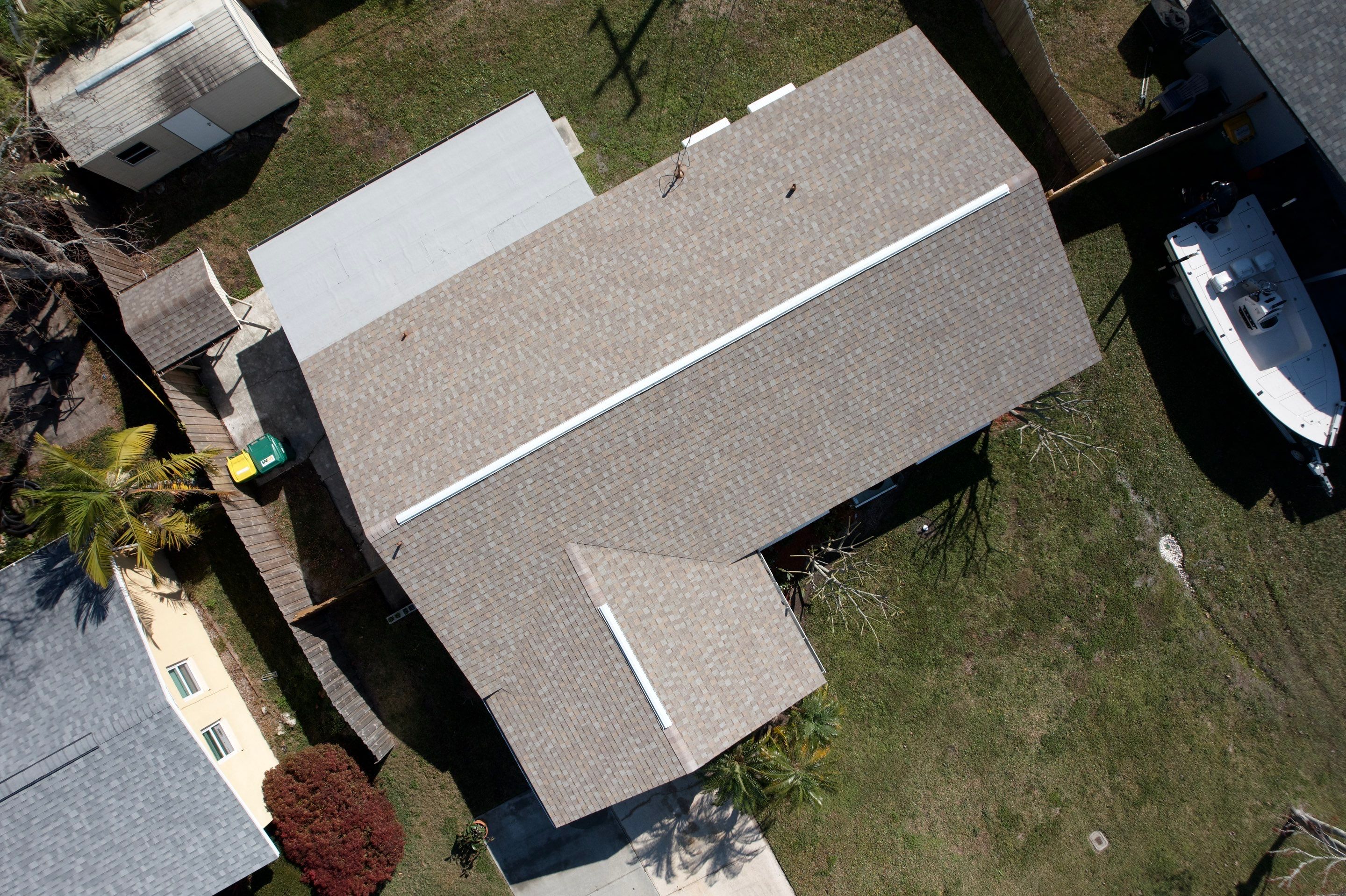 Complete Asphalt Shingle and Flat Roof Replacement in Merritt Island by Wiedmann Construction & Roofing