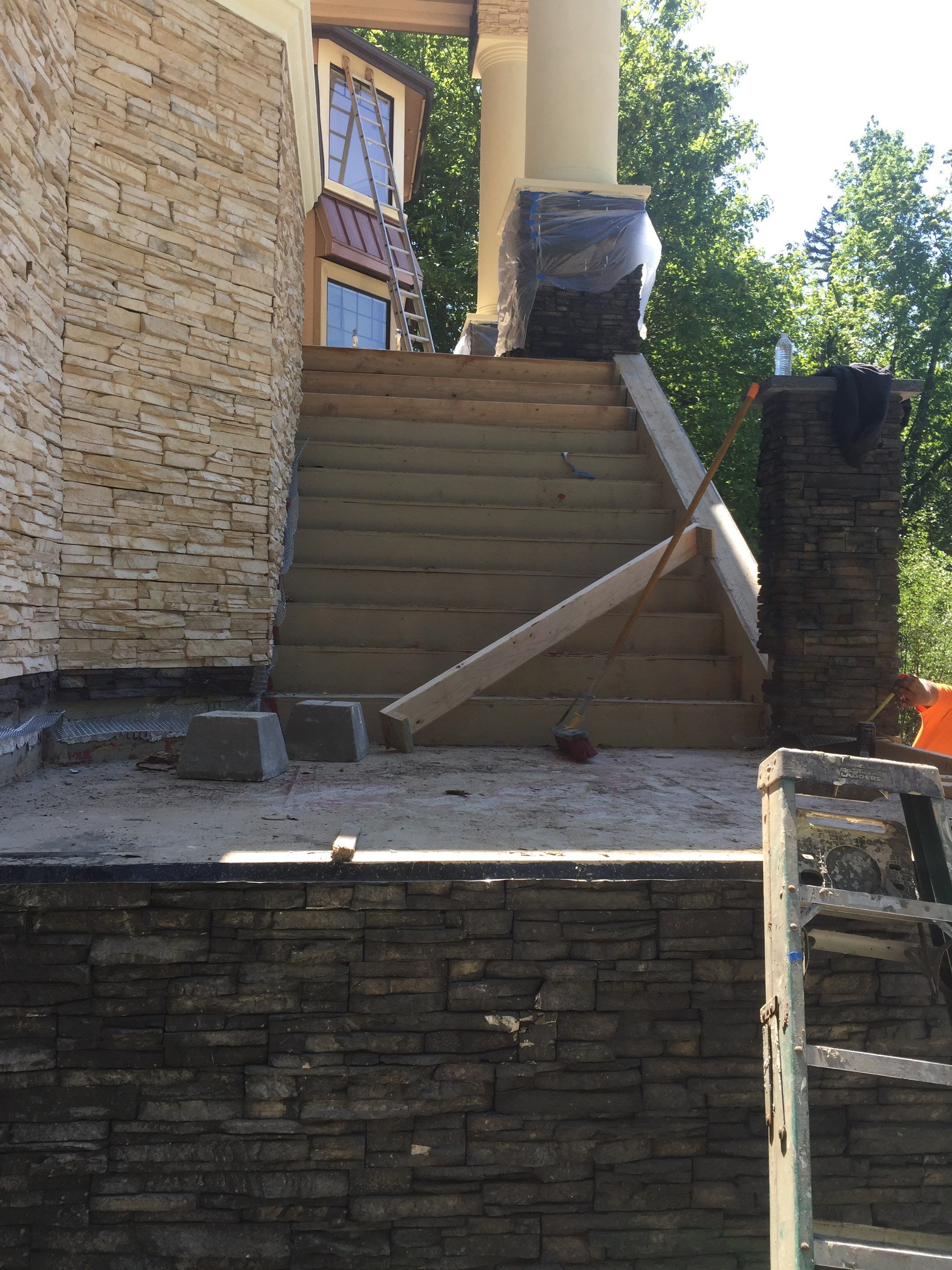 Asphalt Driveway and Stamped Concrete Patio Finish  by Jireh Asphalt & Concrete Inc 