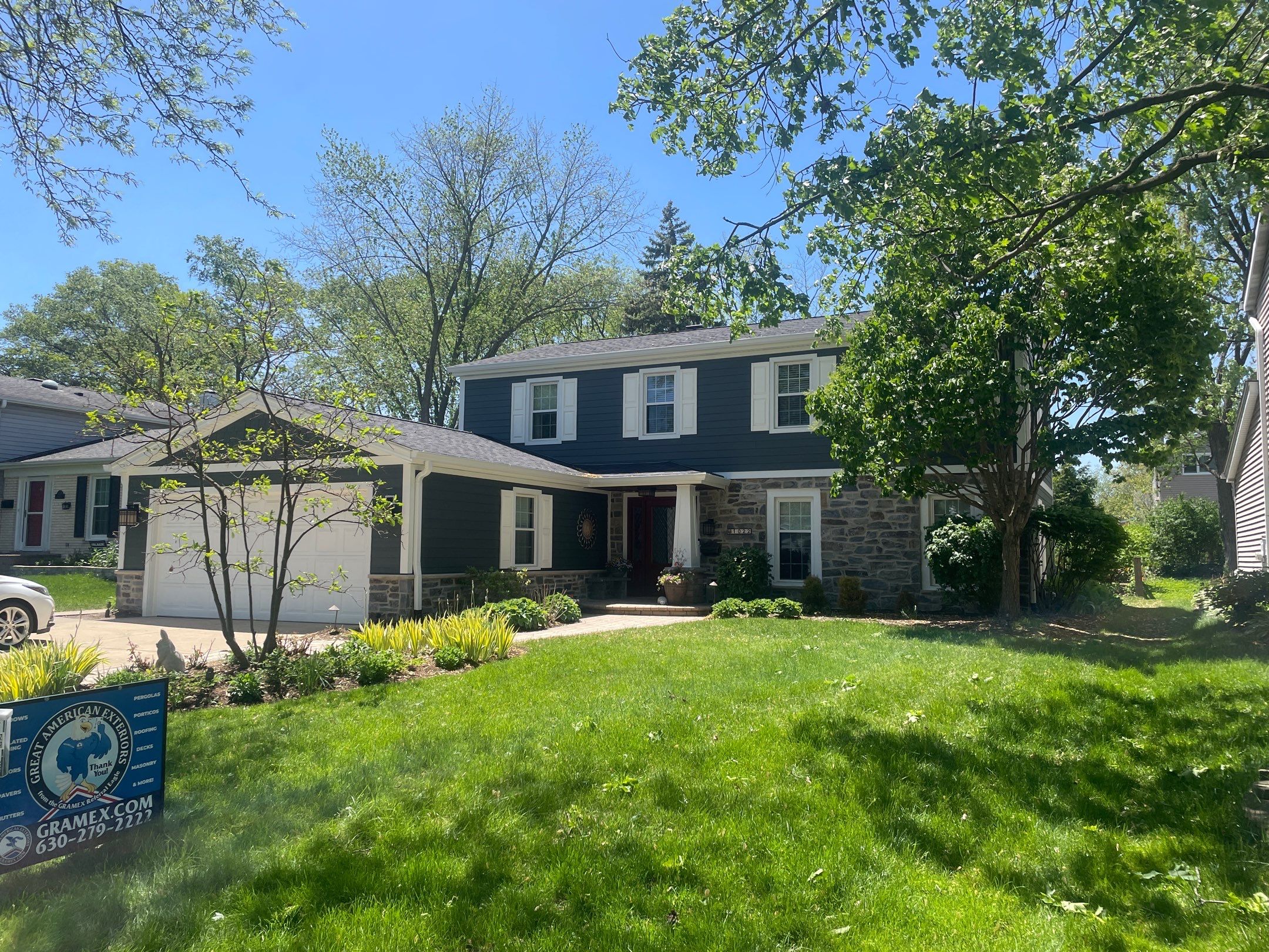 Exterior Renovation with James Hardie Siding and Natural Stone in Lombard by Great American Exteriors