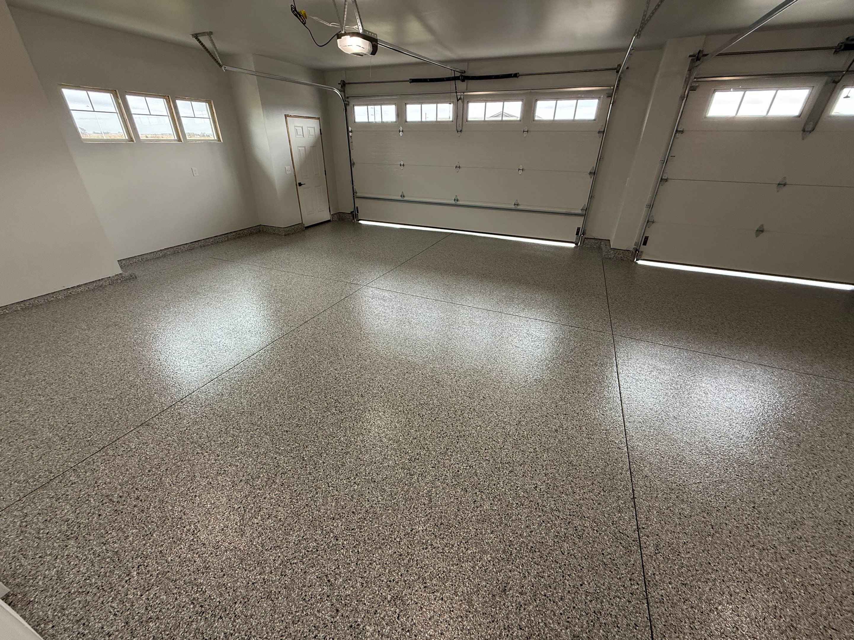 High-Gloss Epoxy Flake Garage Floor Coating in Brandon by Select Painting, Coatings & Garage Cabinets