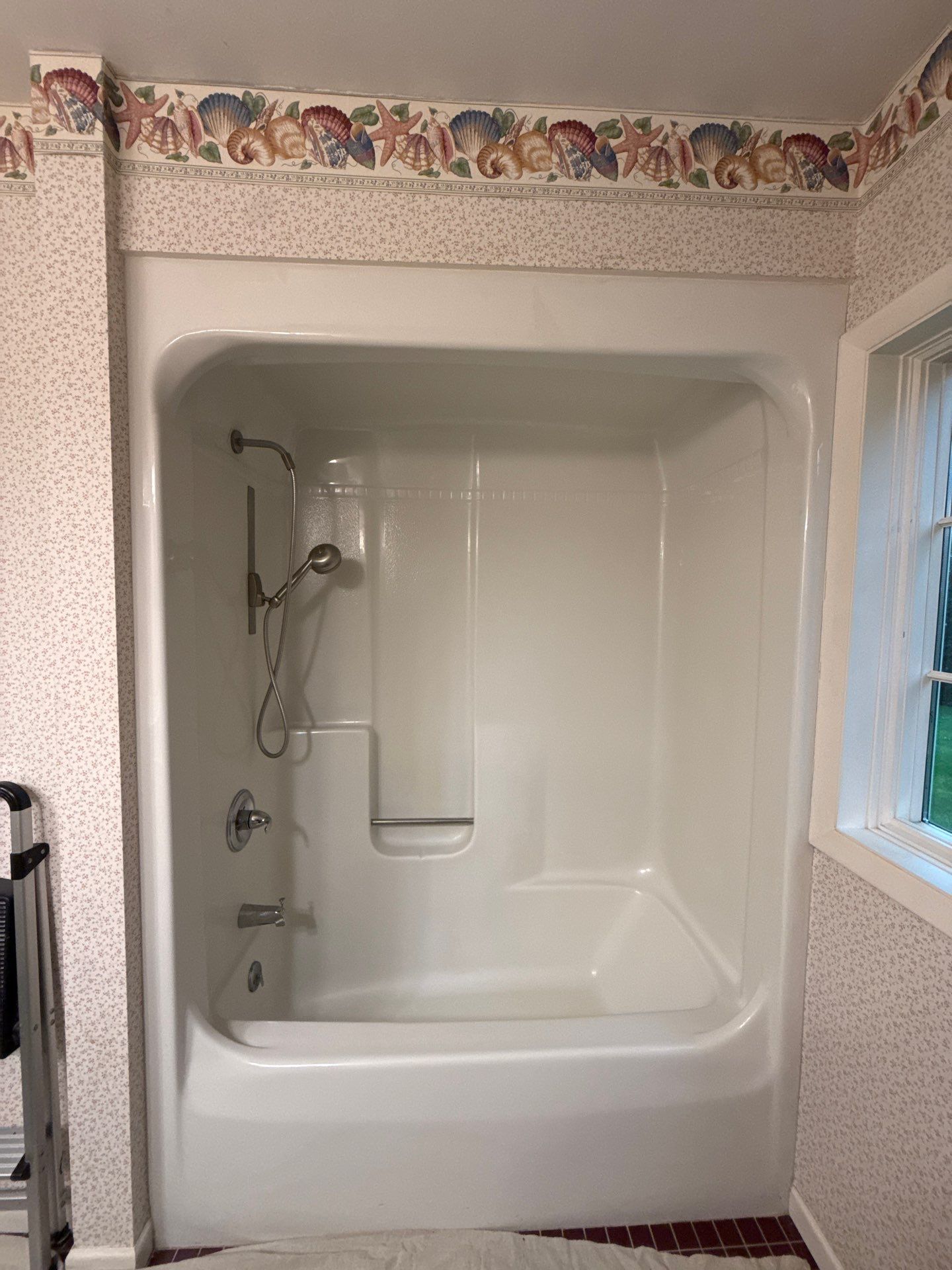 Walk-In Shower Remodel with Herringbone Tiles in Traverse City by Rainbow Seamless Systems