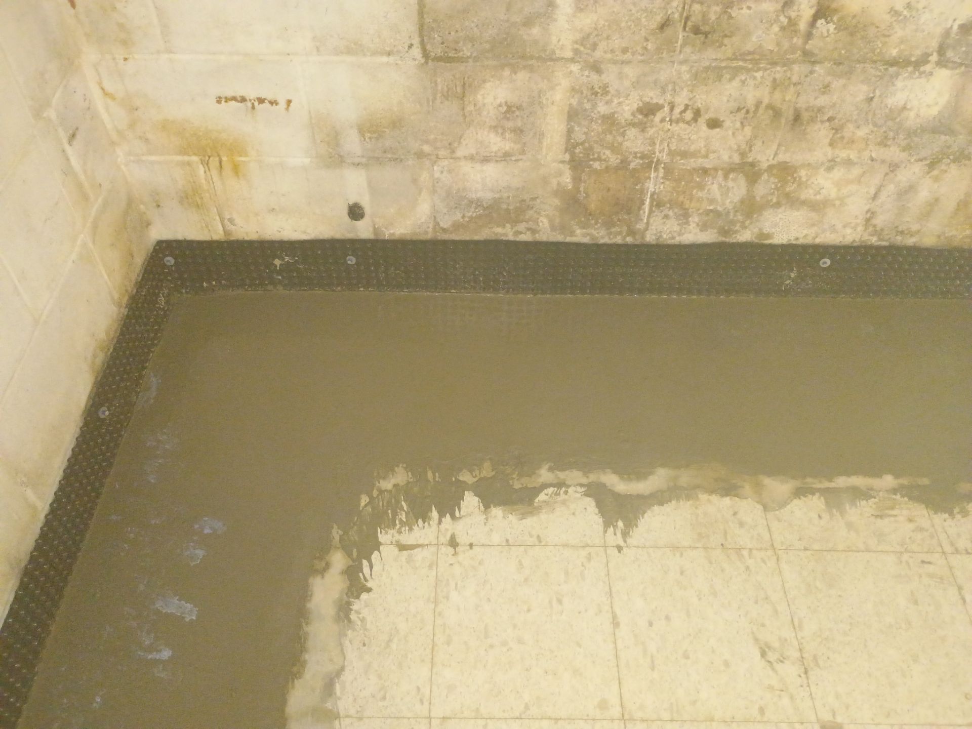 Interior Drain Tile Installation in Columbia Heights, MN by Waterproofing Northeast