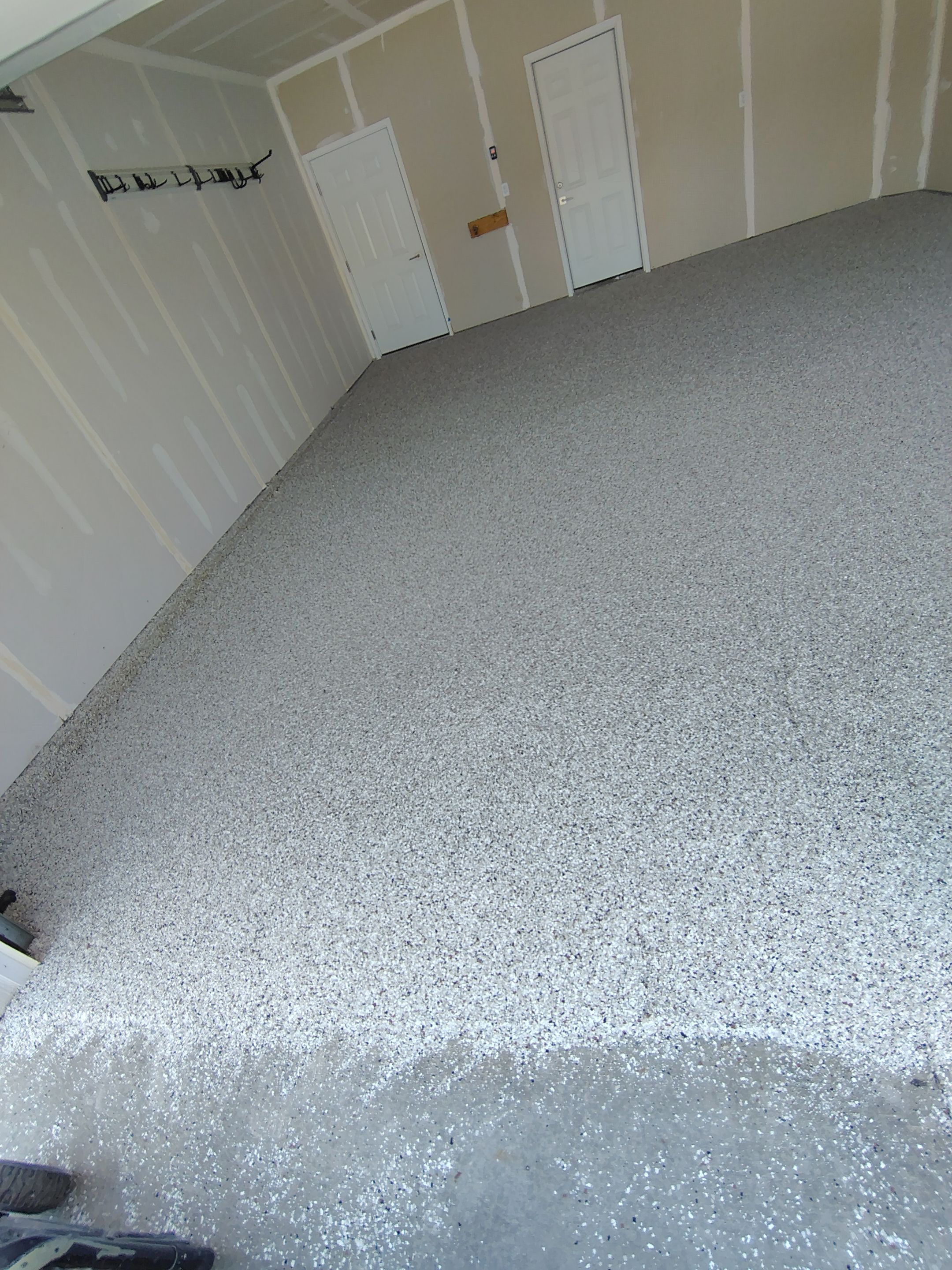 Custom Epoxy Garage Floor and Patio Coating in Sioux Falls by Select Painting, Coatings & Garage Cabinets