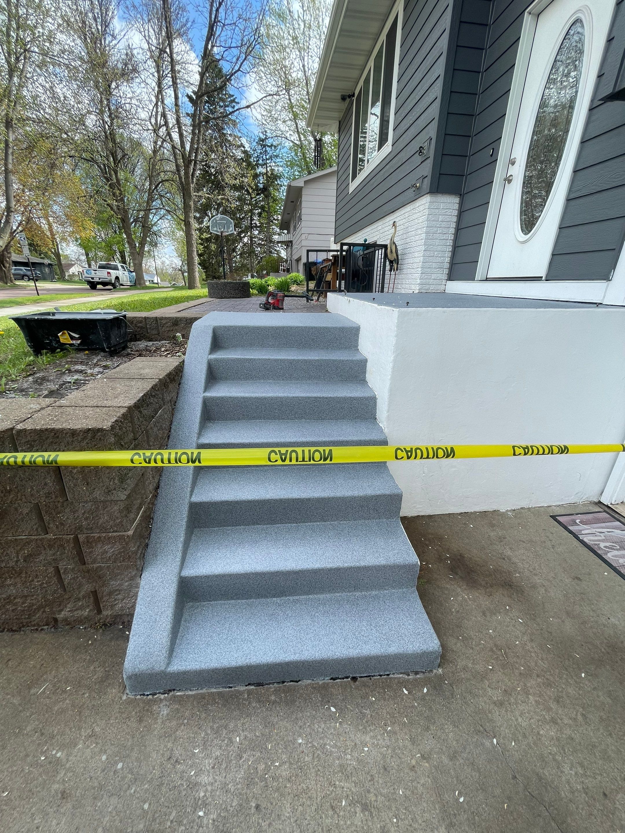 Grey Polyaspartic Porch and Stair Resurfacing in Sioux Falls by Select Painting, Coatings & Garage Cabinets