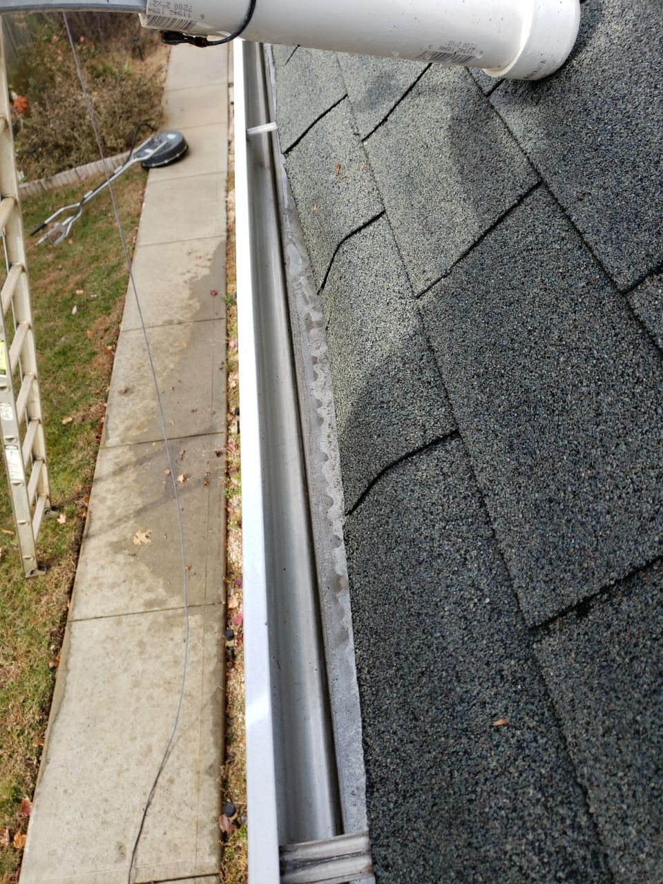 gutters and Driveway by Power Wash Masters LLC