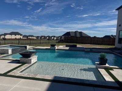 Modern Geometric Pool with Raised Spa, Tanning Ledge and Fire Bowls