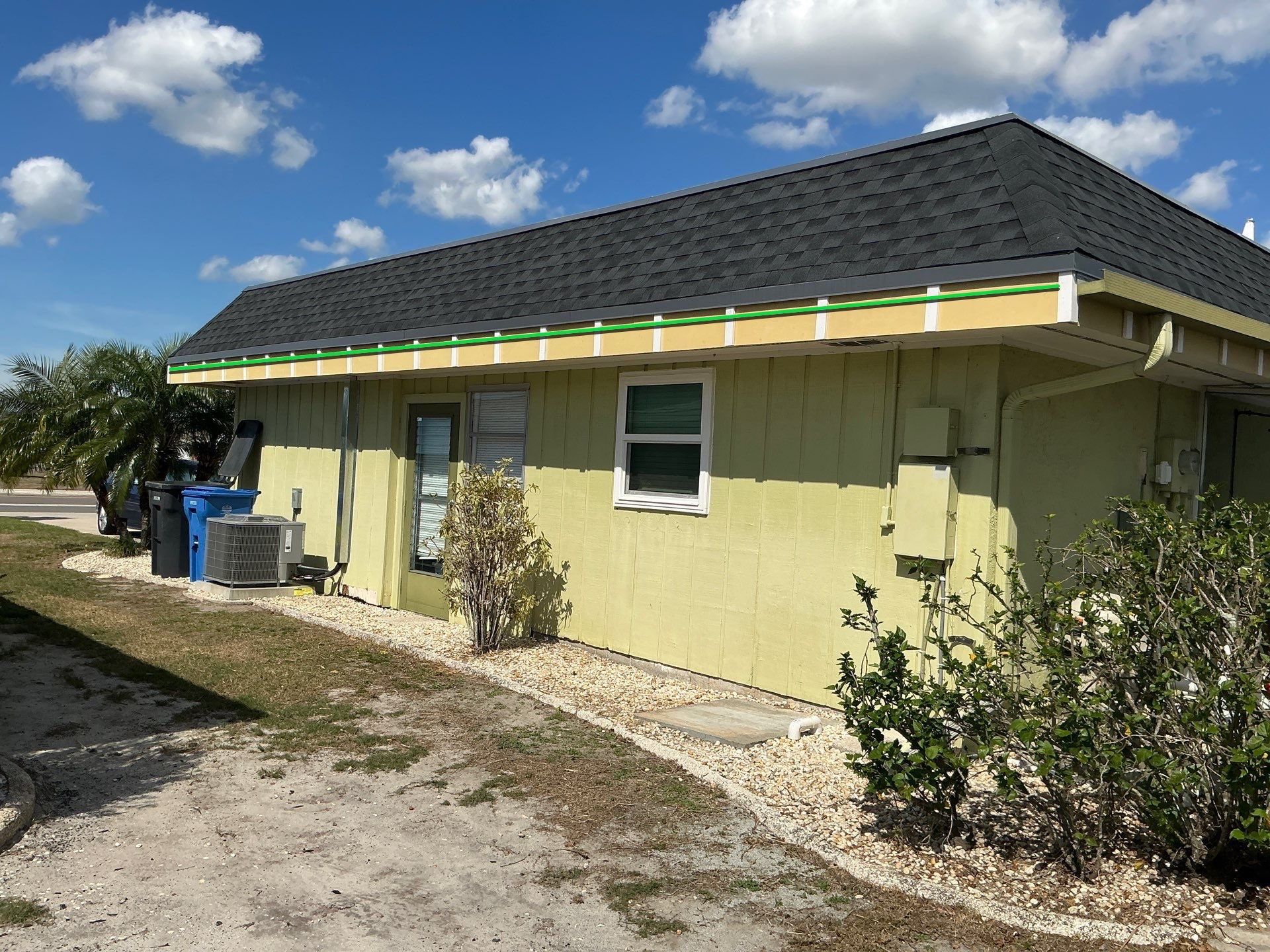 Black 6'' Seamless Gutters K-Style and Black Downspouts in Sun City Center FL by Gutter Professors