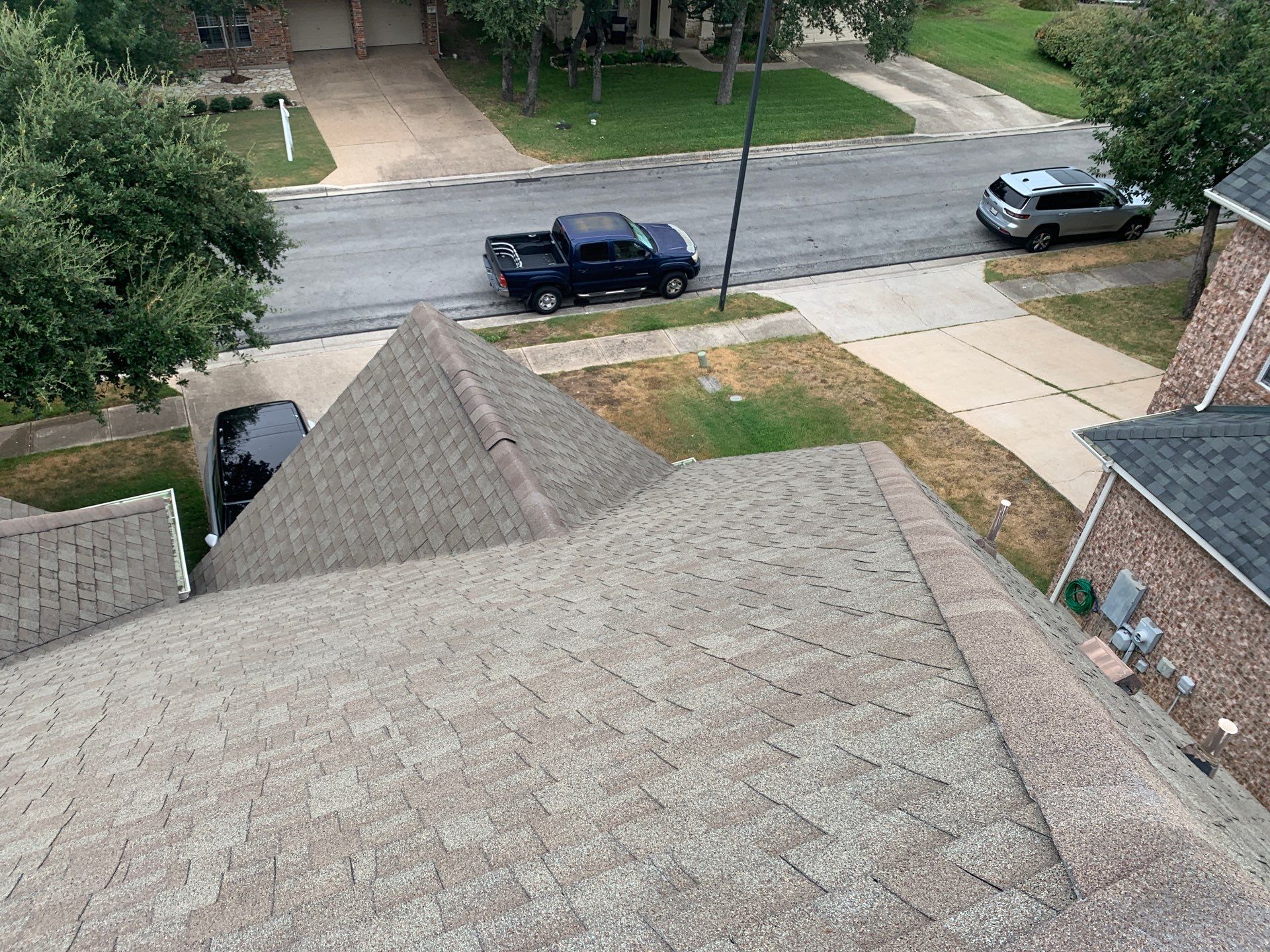 Hail Damage Restoration and Asphalt Shingle Roof Replacement in Austin by Caliber Restoration LLC