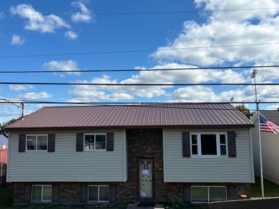 Residential Roofing Installation using Metal