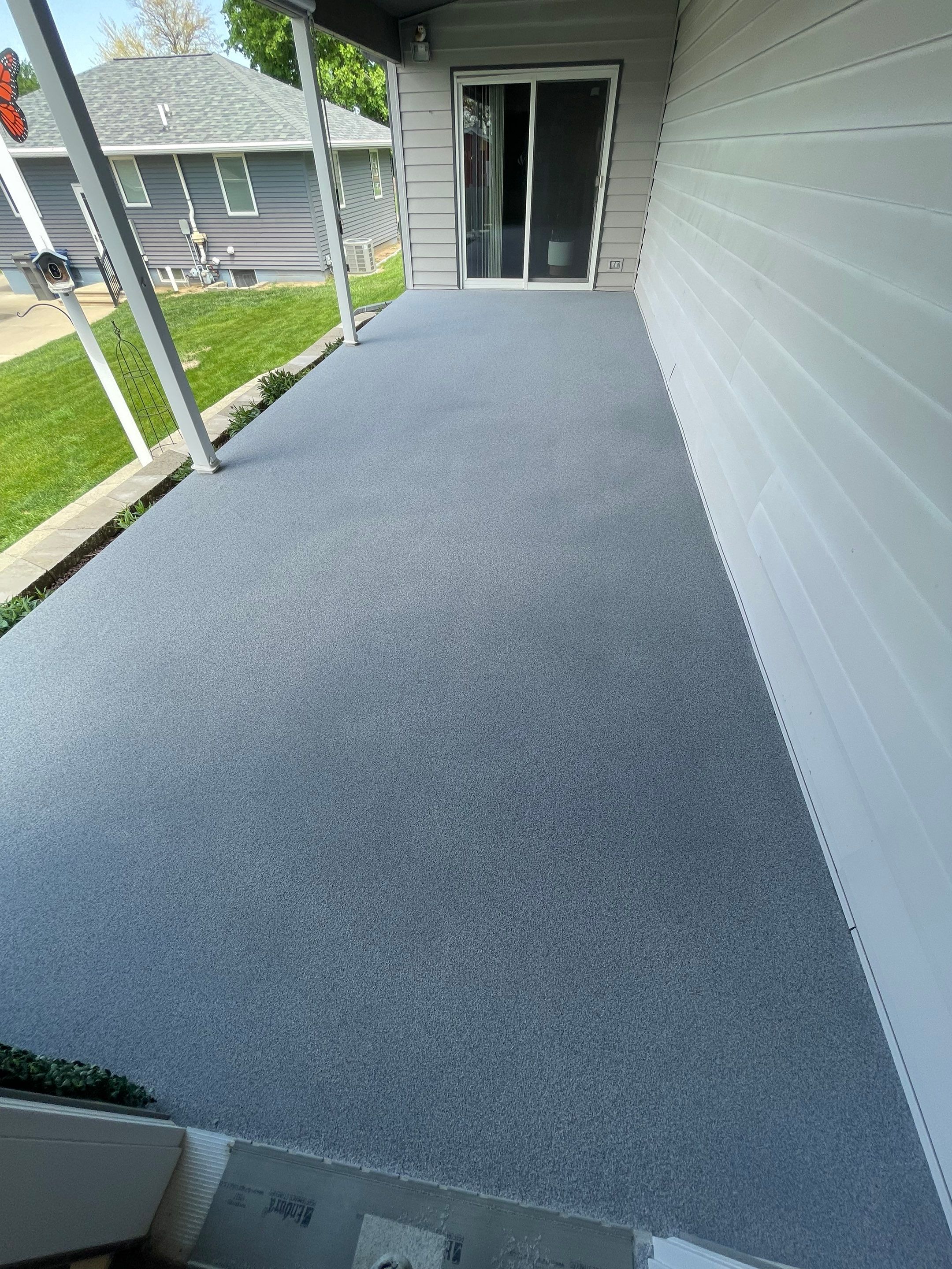 Custom Grey Flake Epoxy Garage Floor Installation in Remsen by Select Painting, Coatings & Garage Cabinets