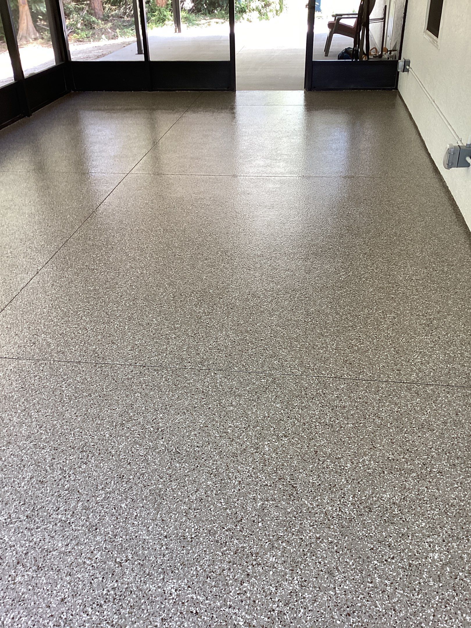 Patio using Pebble Beach by Amvet concrete coatings llc
