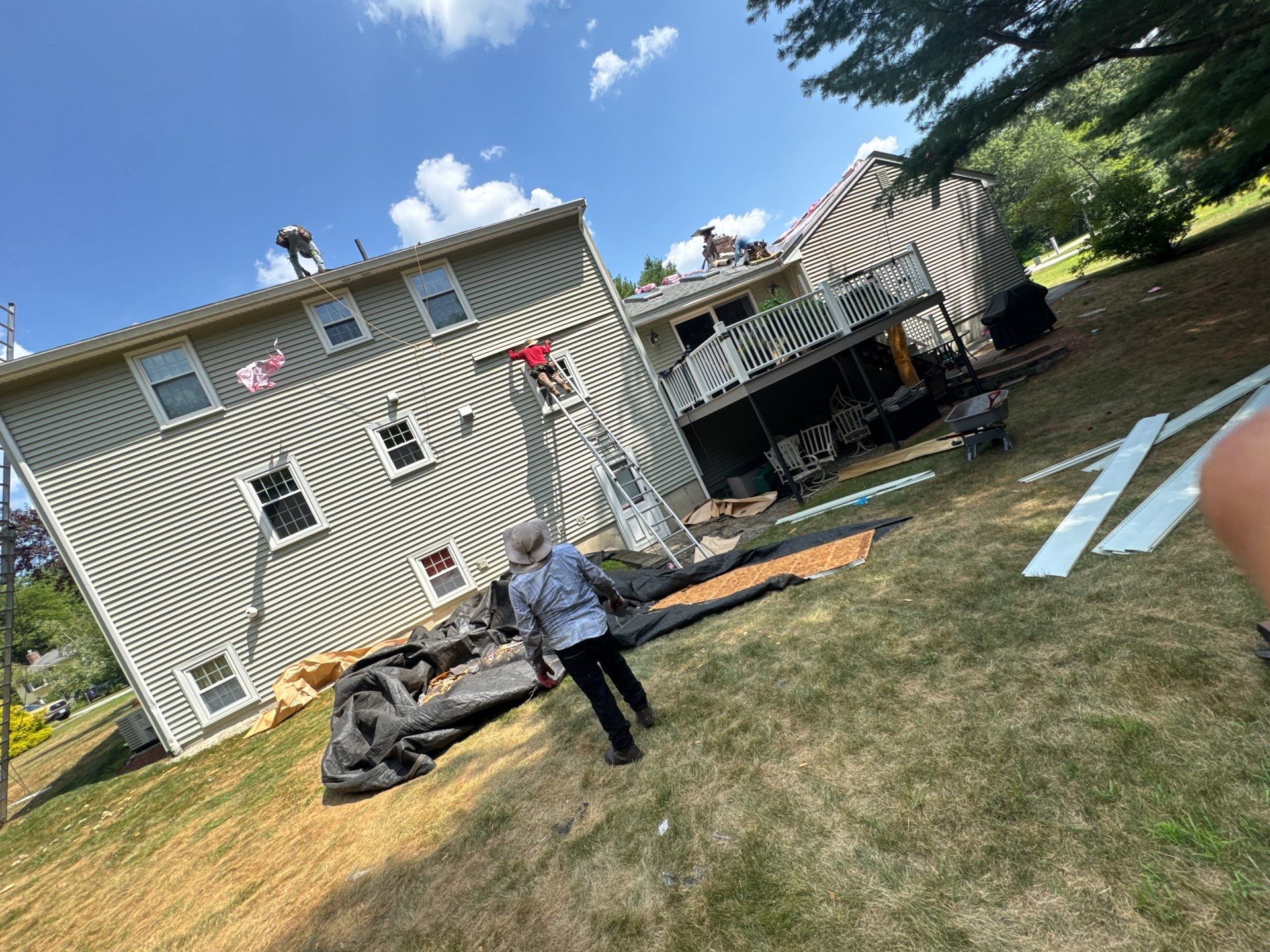 Complete Roof Replacement with Chimney Flashing, Gutter Guard System, and Vinyl Siding Repairs by Mighty Dog Roofing of Greater Middlesex County