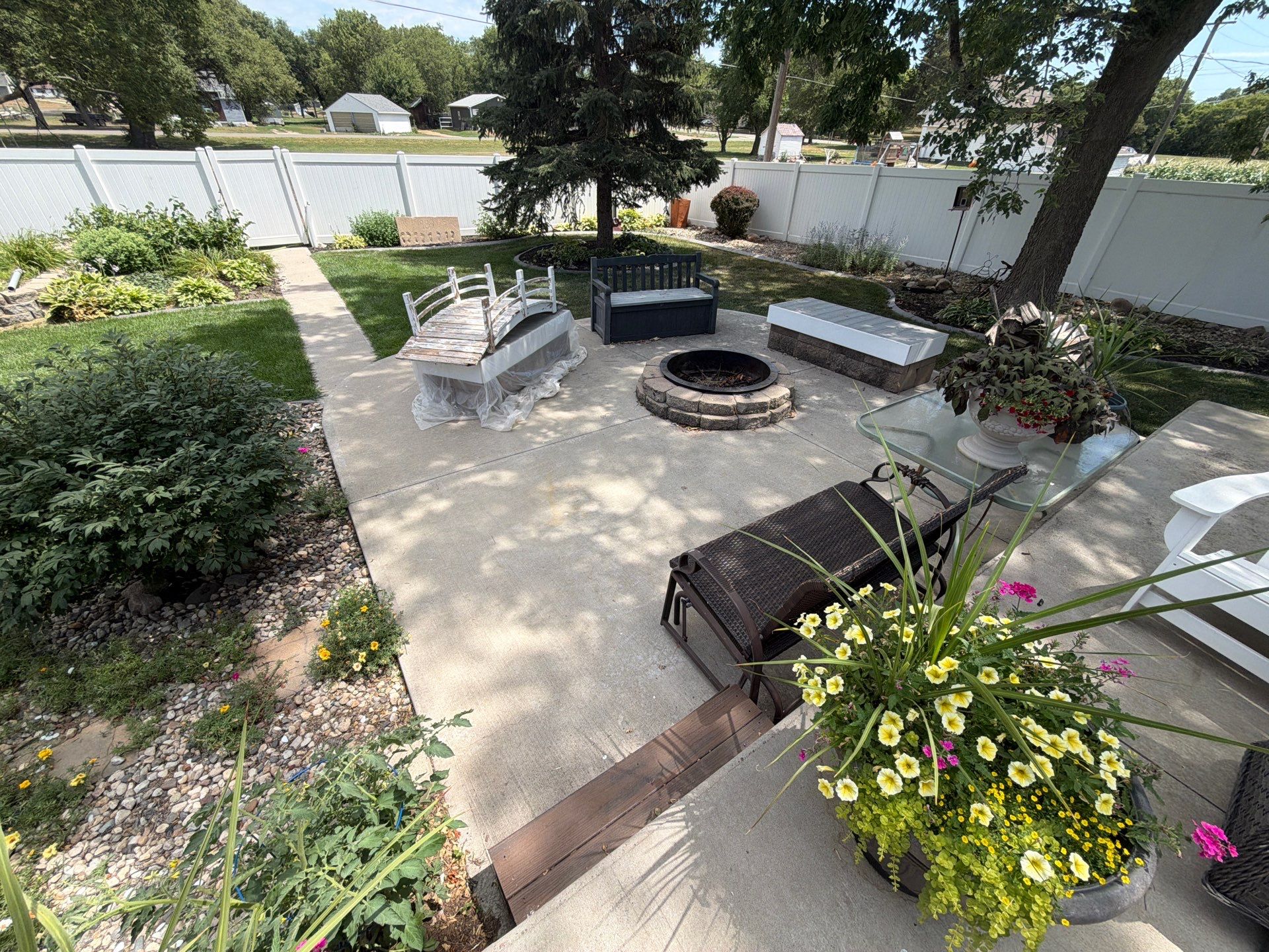 Custom Garage Floor Coating and Backyard Patio Refinishing in Tyndall by Select Painting, Coatings & Garage Cabinets
