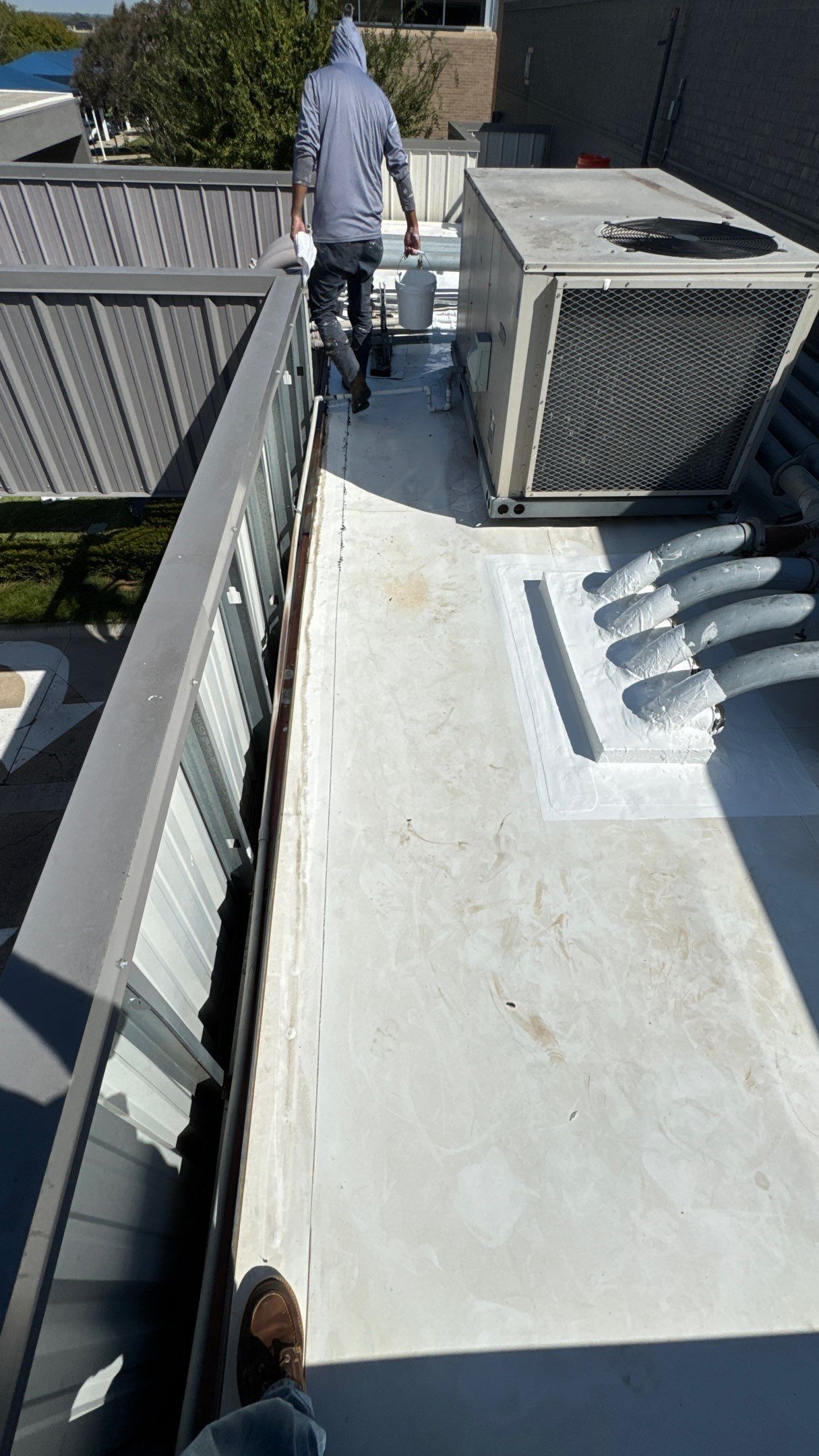 Commercial Roofing Repair using TRP #924 Eterna-Sil Premium Silicone Roof Coating by Harvey Roofing & Construction