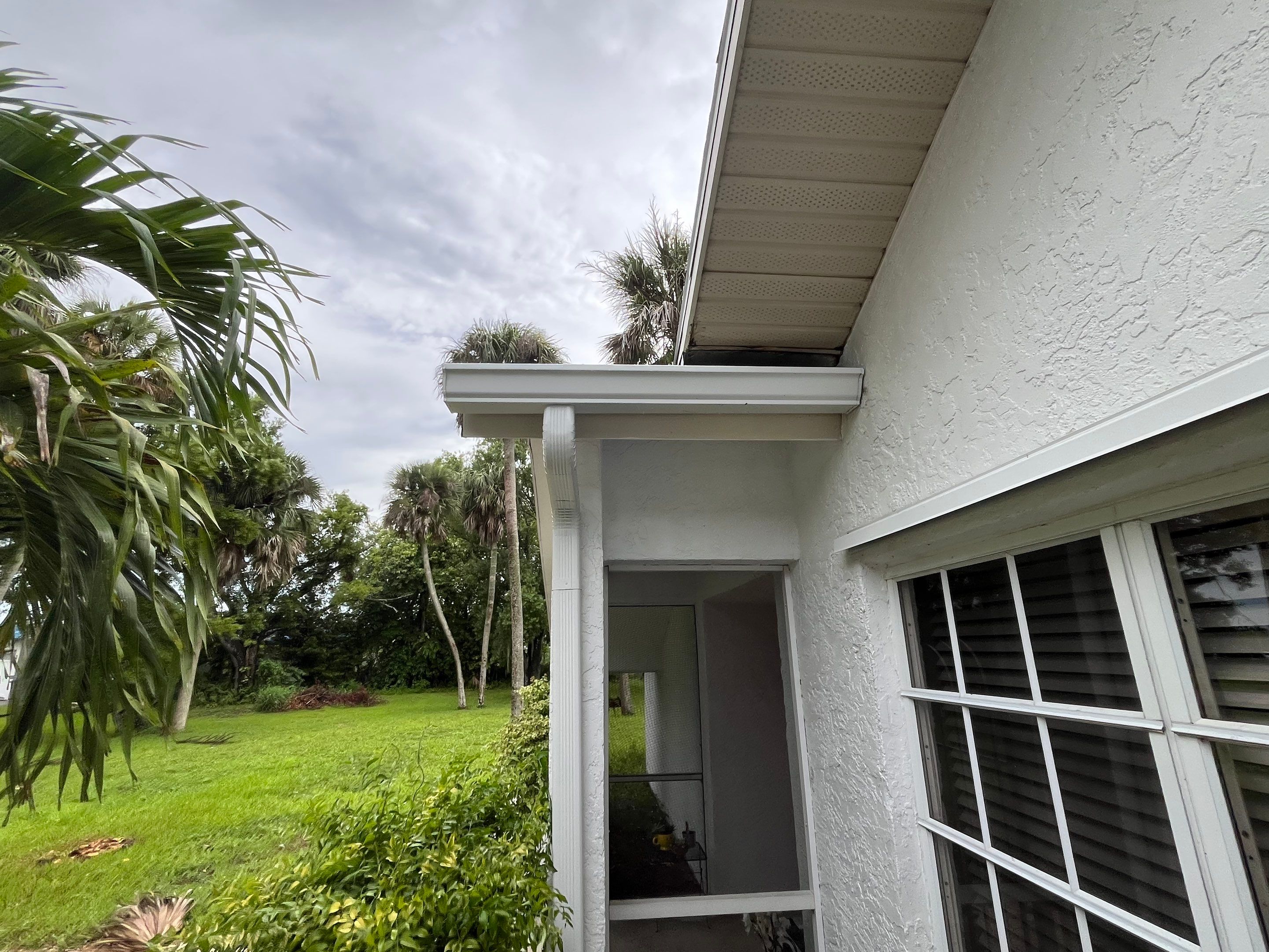 White Seamless Gutters with Splash Guards in North Fort Myers FL by Gutter Professor   by Gutter Professors