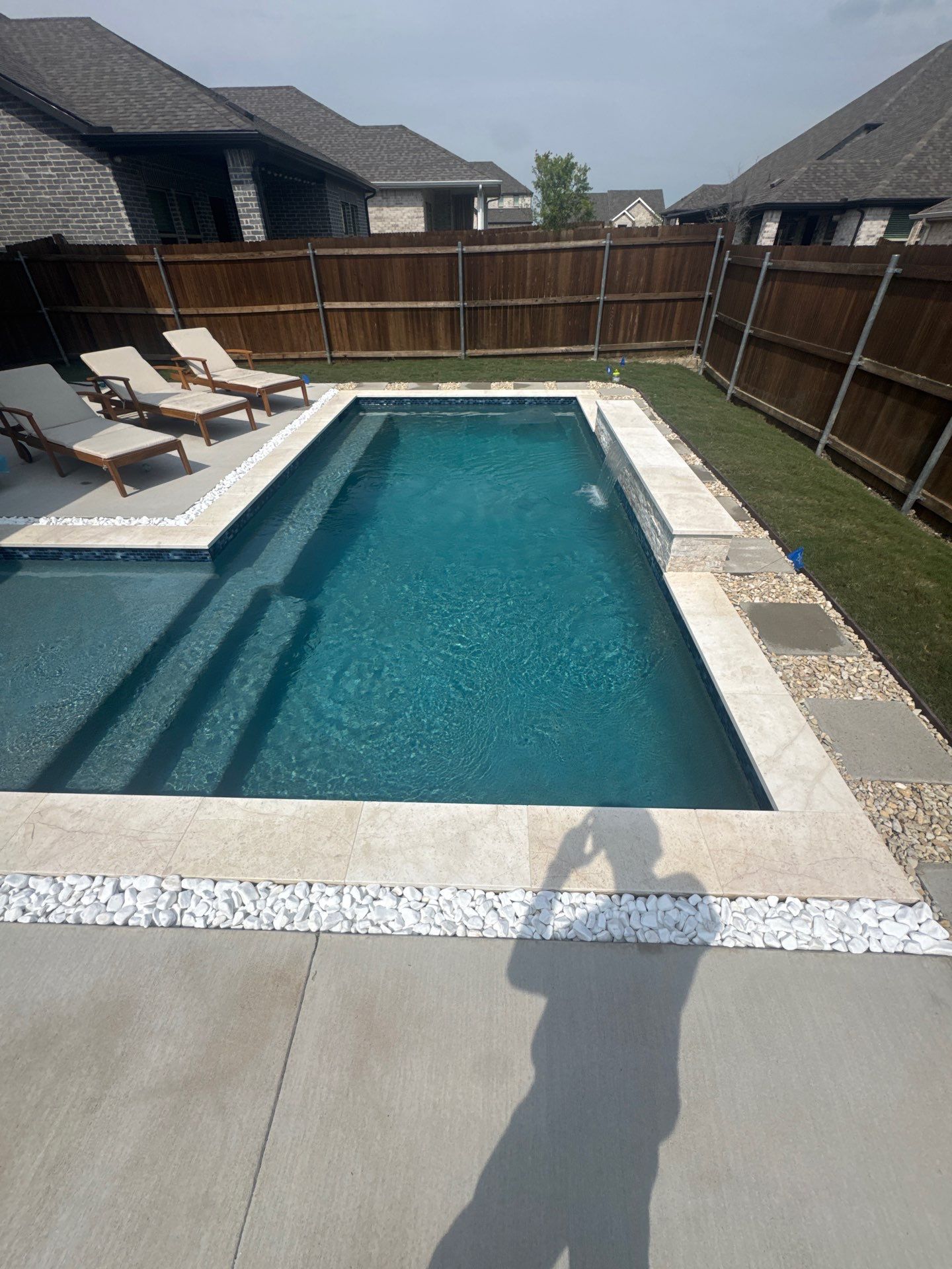 Sleek Geometric Pool with Tanning Ledge and Turf by Pinnacle Pools and Spas - DFW