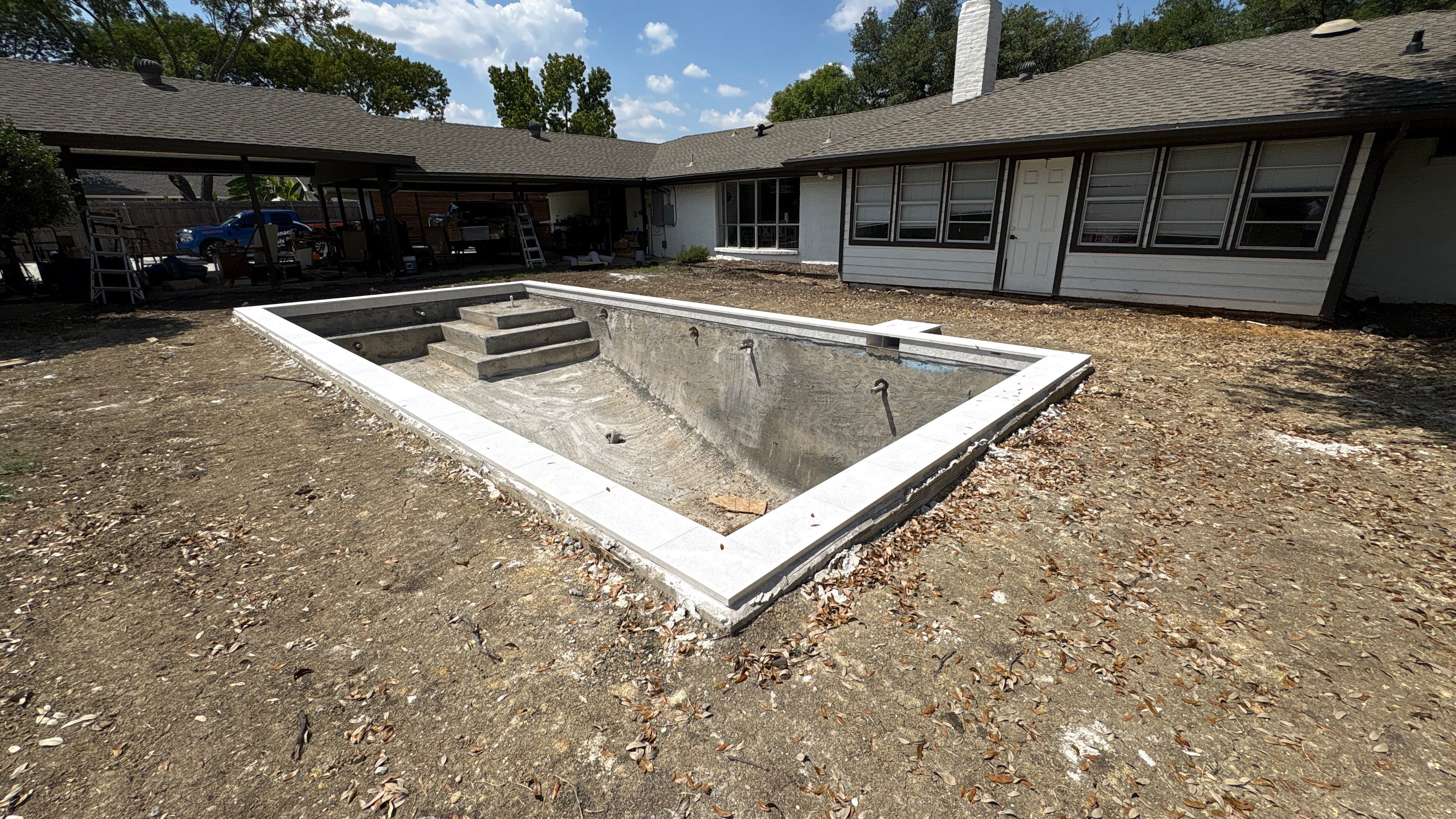 Crisp Geometric Pool with White Coping by Pinnacle Pools and Spas - DFW